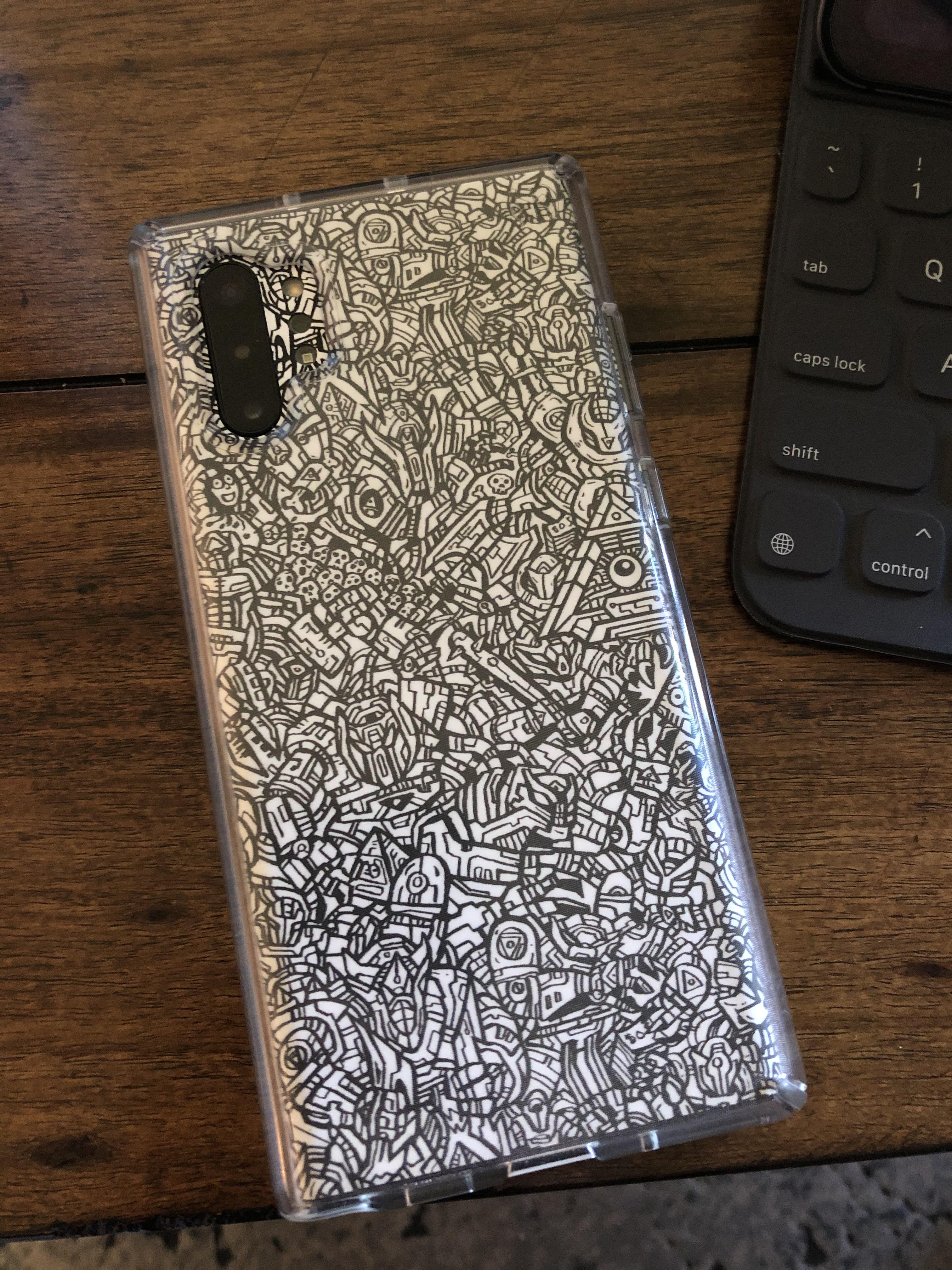 For those wondering about a skin with a case. DBrand Robot skin, Speck
