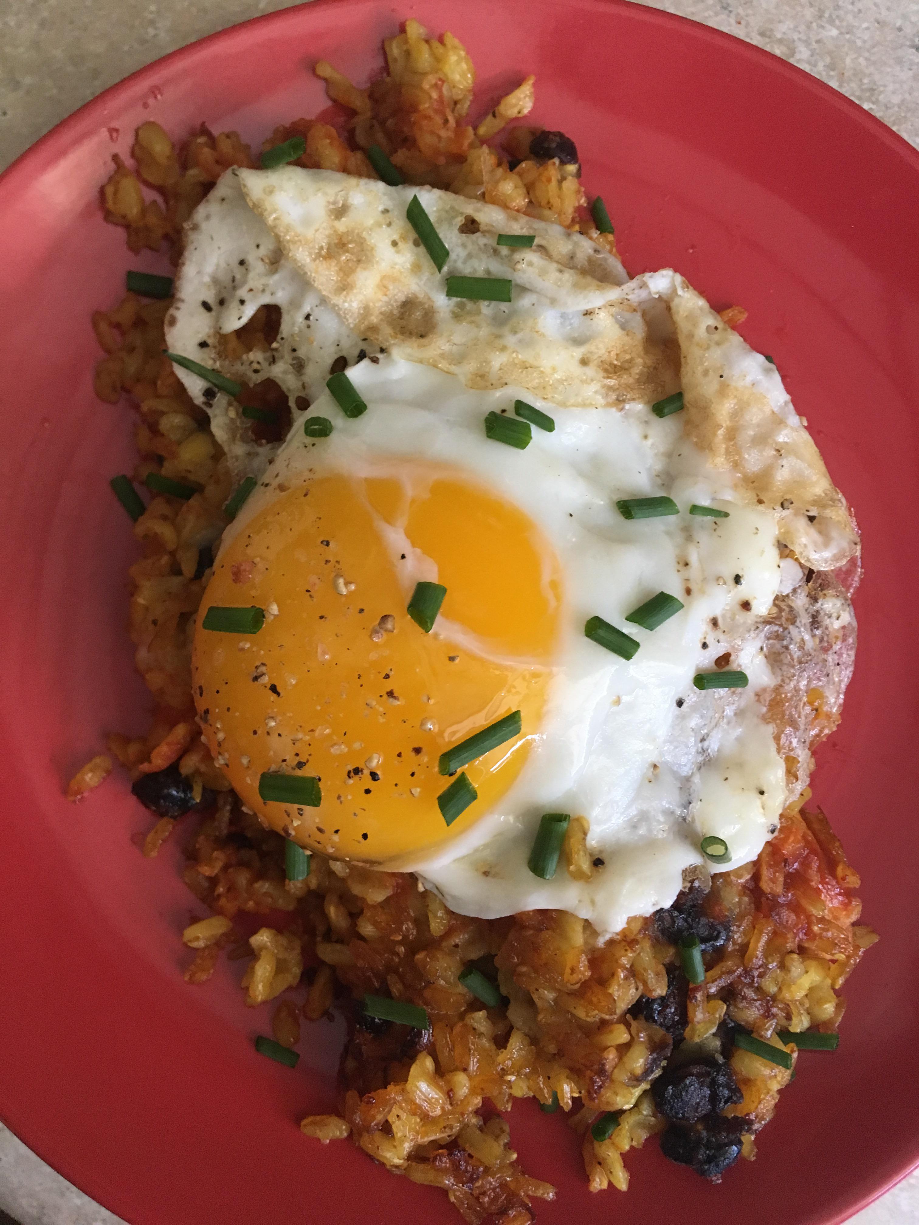 mexican fried rice stuffed with cheese and a chive covered egg 😊 r