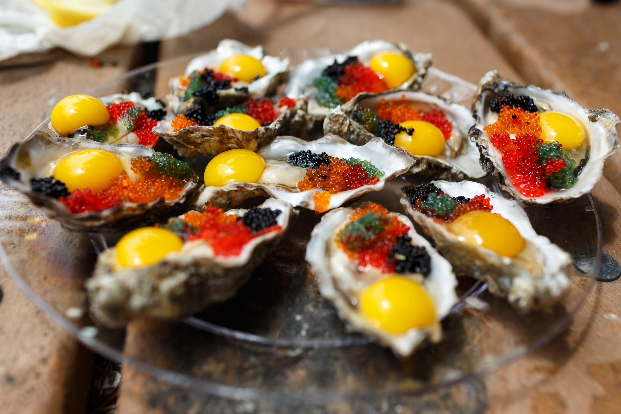 Self shucked oysters from Tomales Bay topped with colorful flying fish