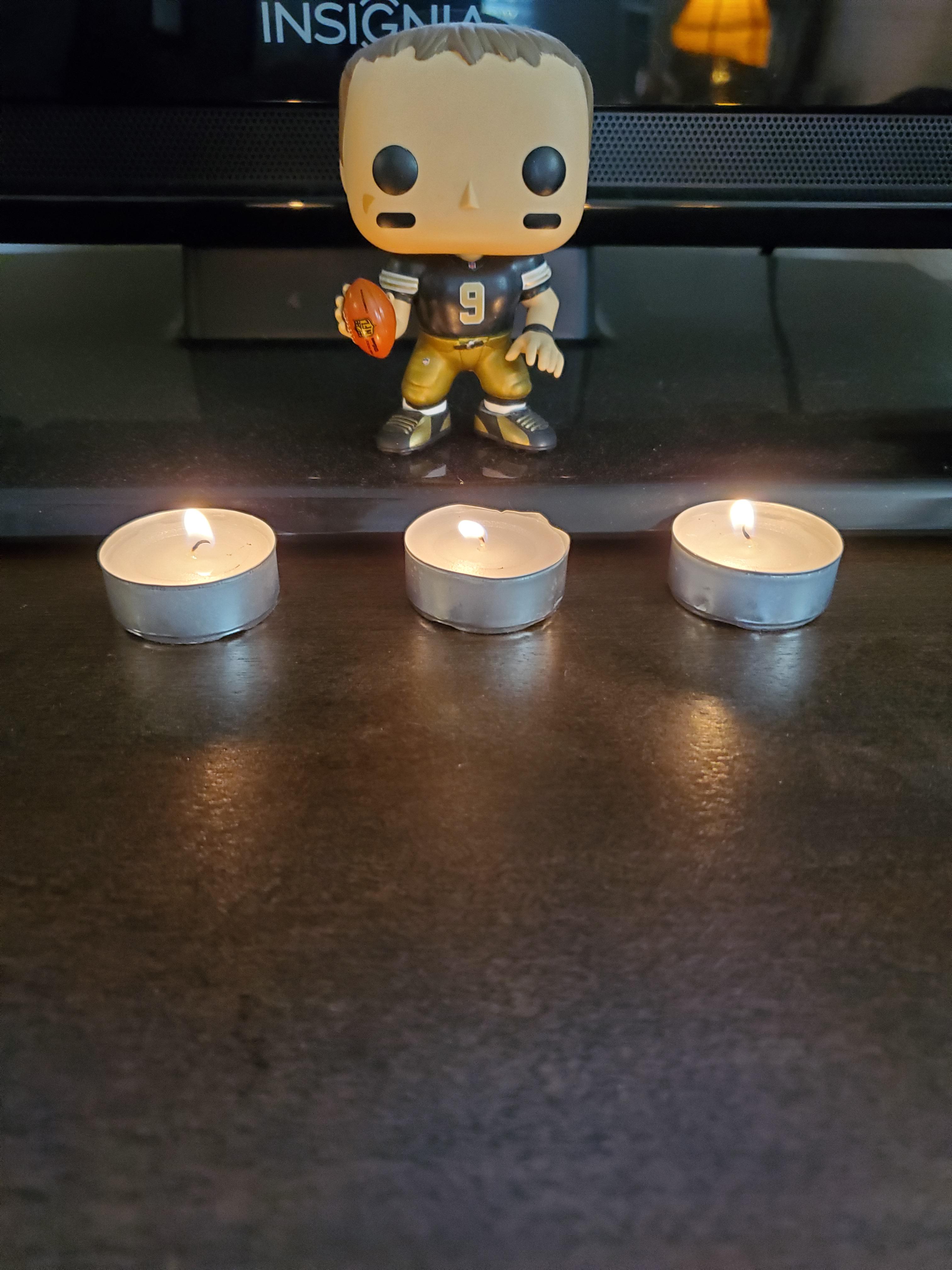 Made a makeshift candlelight vigil to the patron Saint of passing