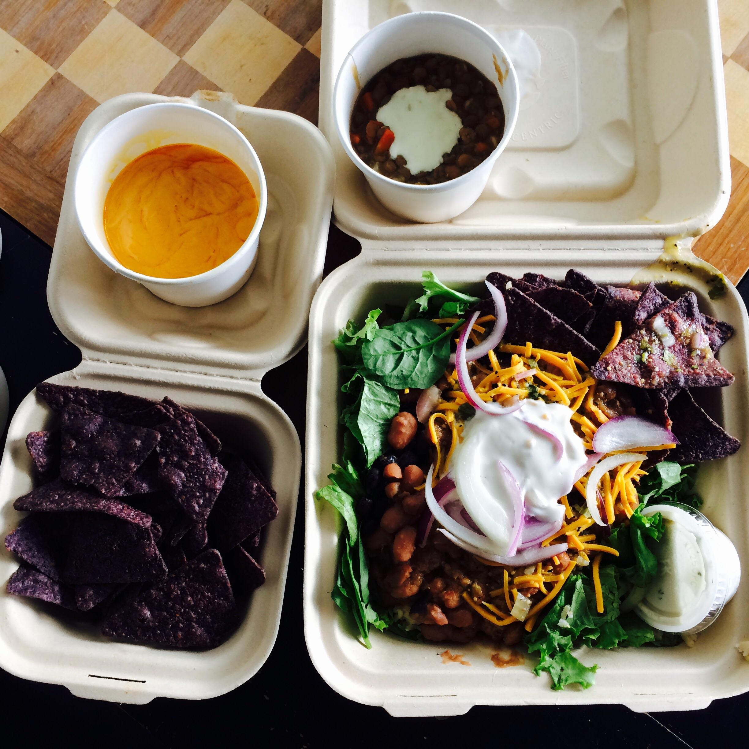 Vegan taco salad, queso and chips and lentil soup delivered to me