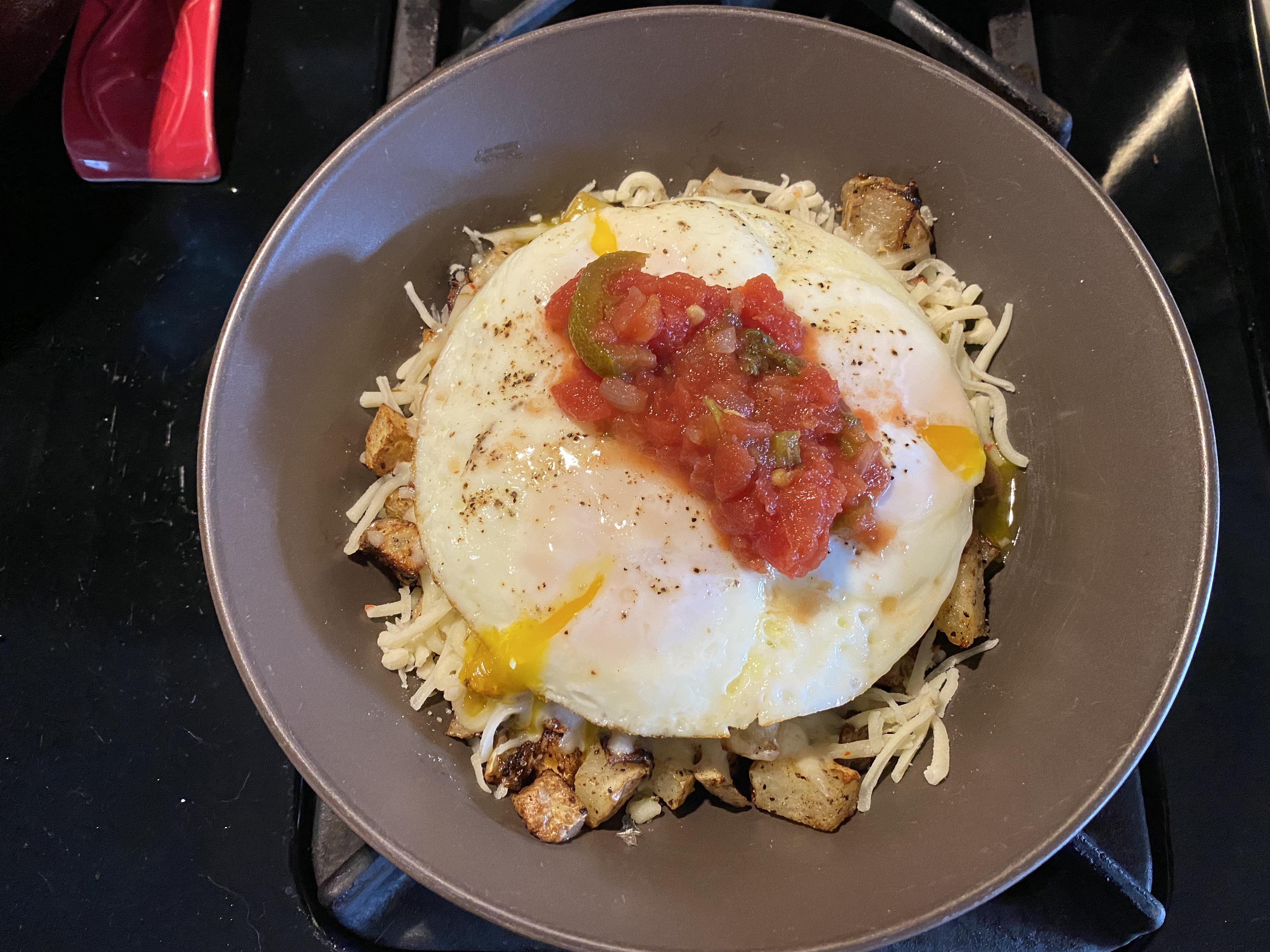 Classic. Cast iron eggs over potatoes, onion, apple hash. Bit of spicy