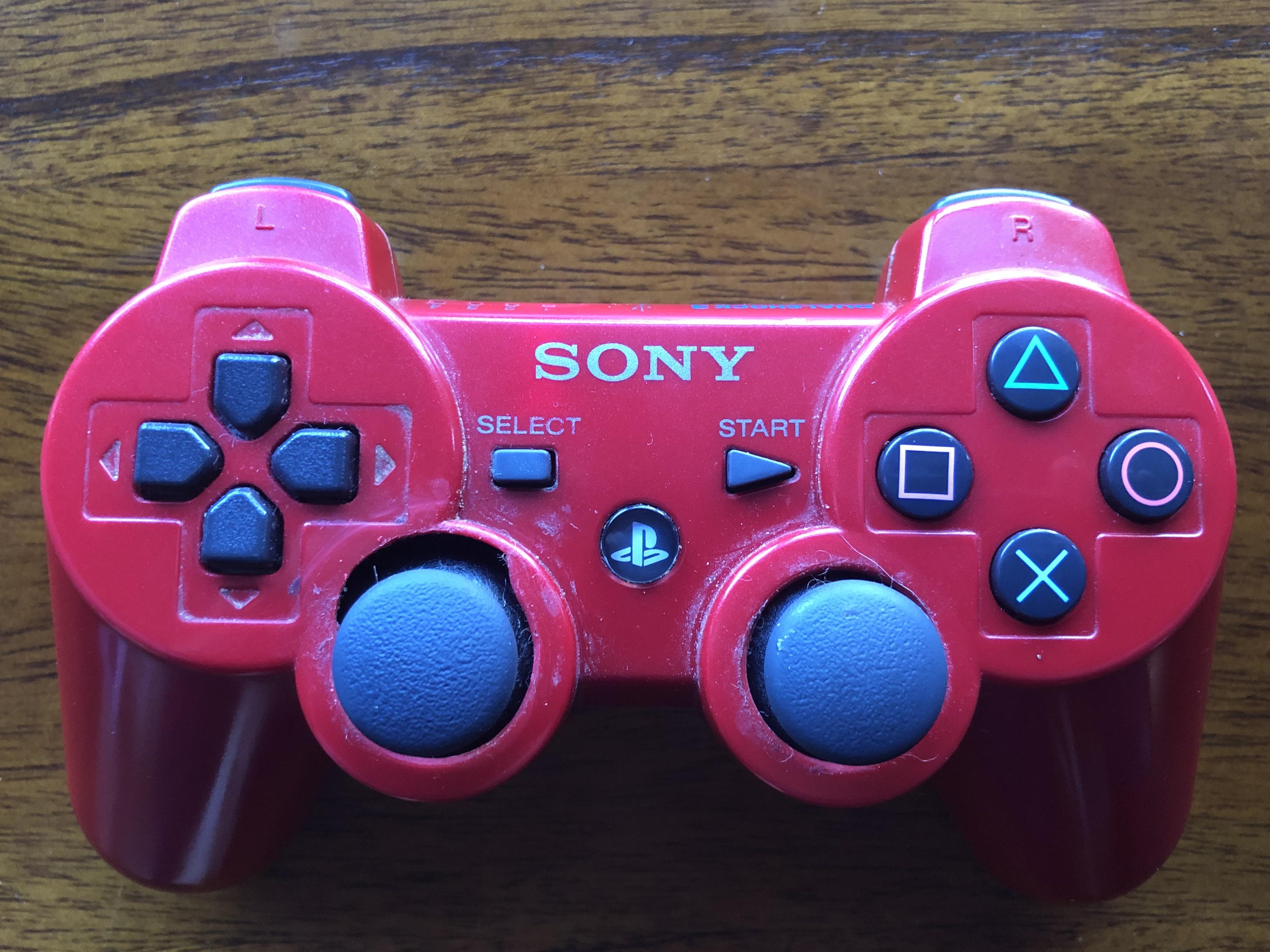 My PS3 controller. The plastic above the left stick is worn away from