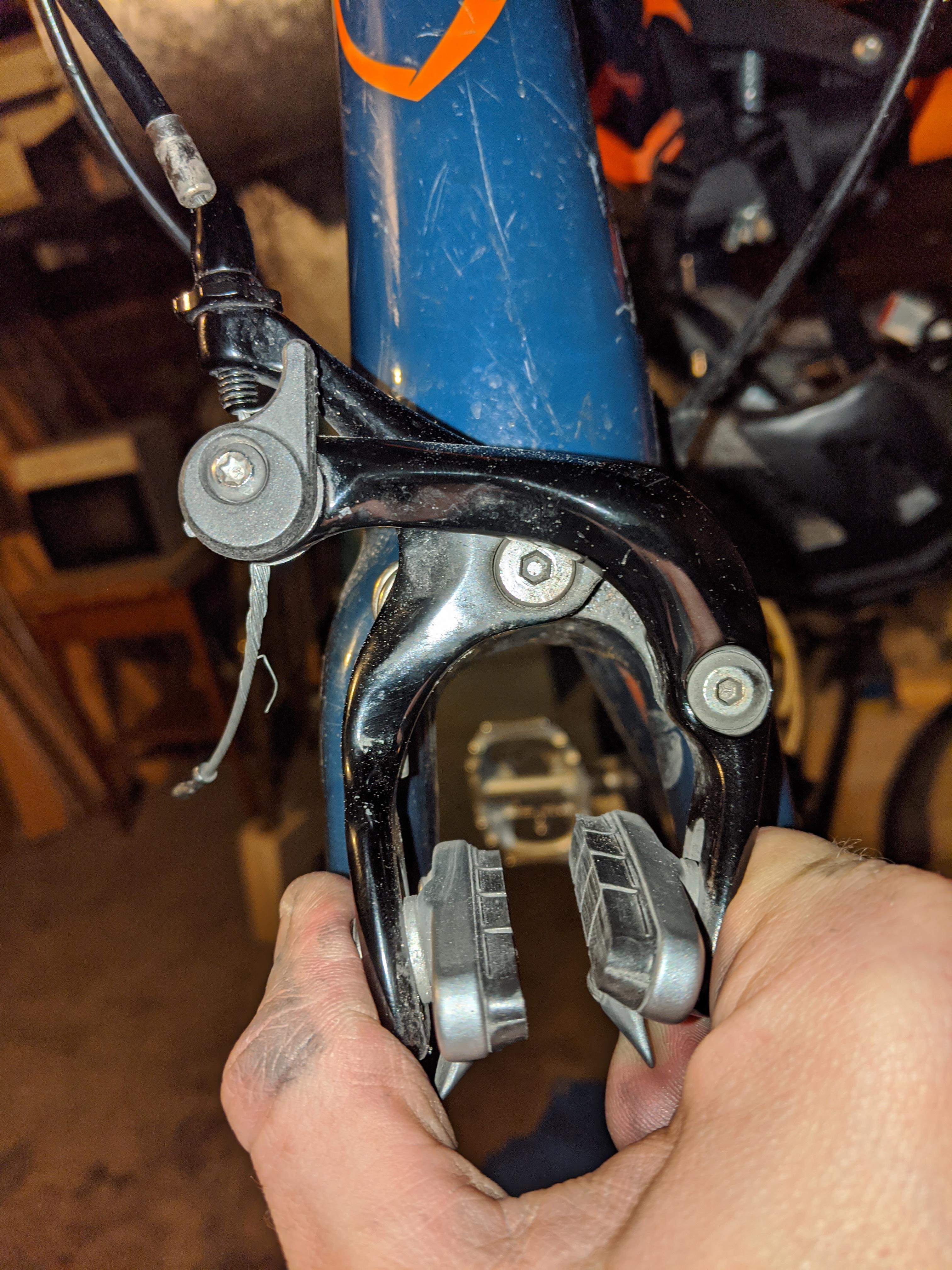 How do I remove this brake caliper? I believe it's a Shimano 105 r7000