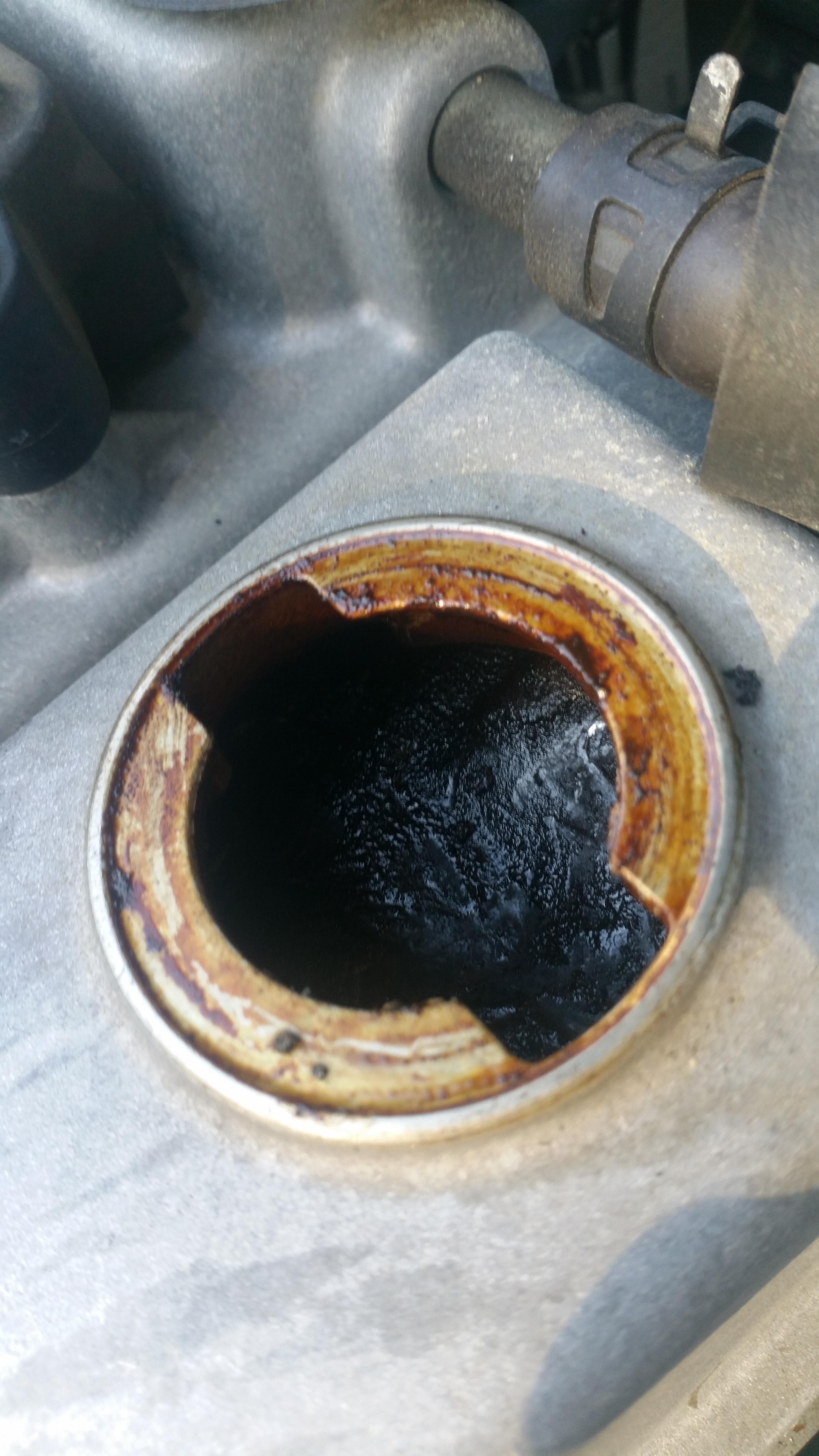 Hardened oil sludge under oil filler cap? r/MechanicAdvice