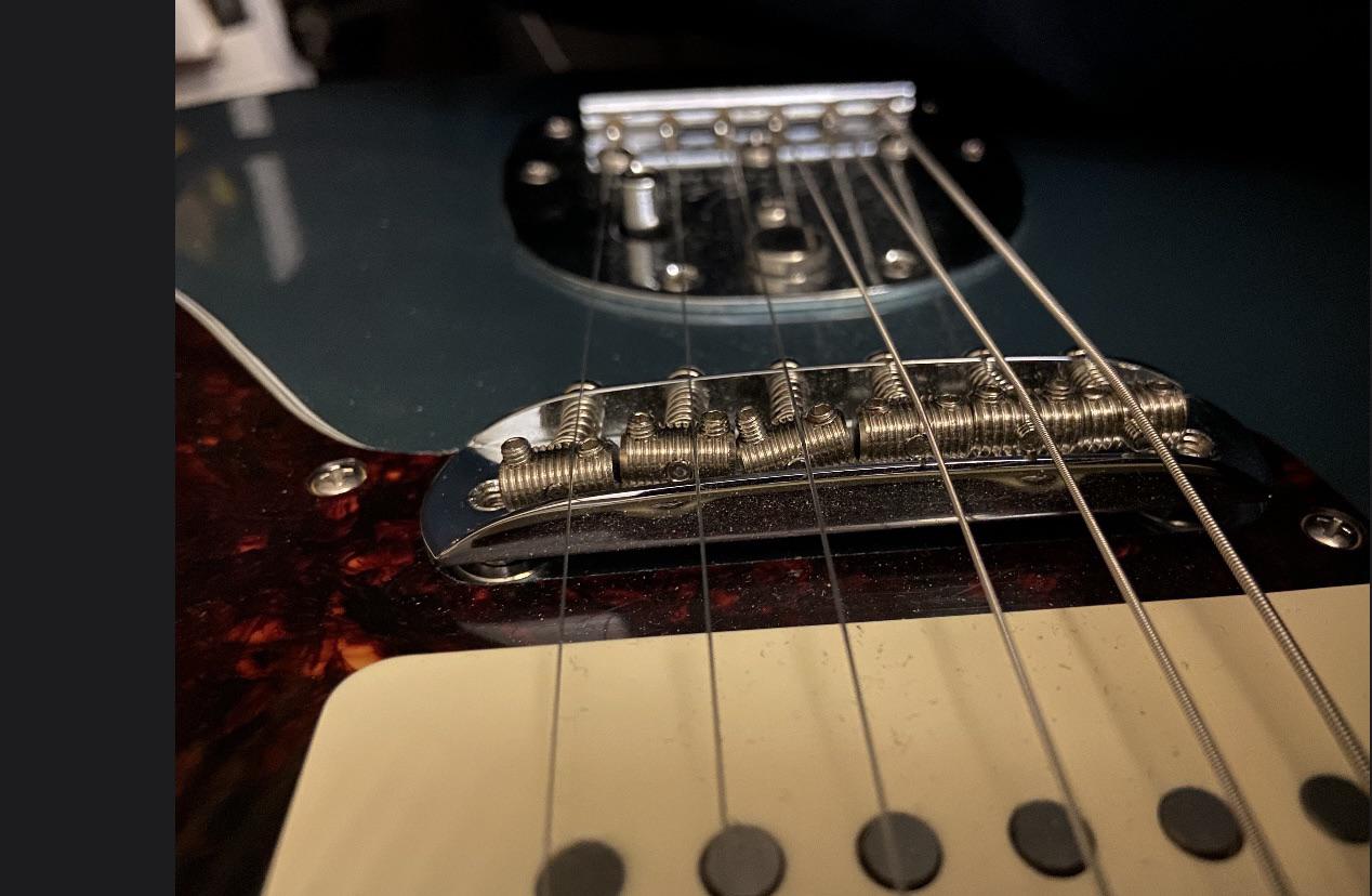 Crooked saddles, getting a lot of buzzing on G string, how to fix? r/guitarlessons