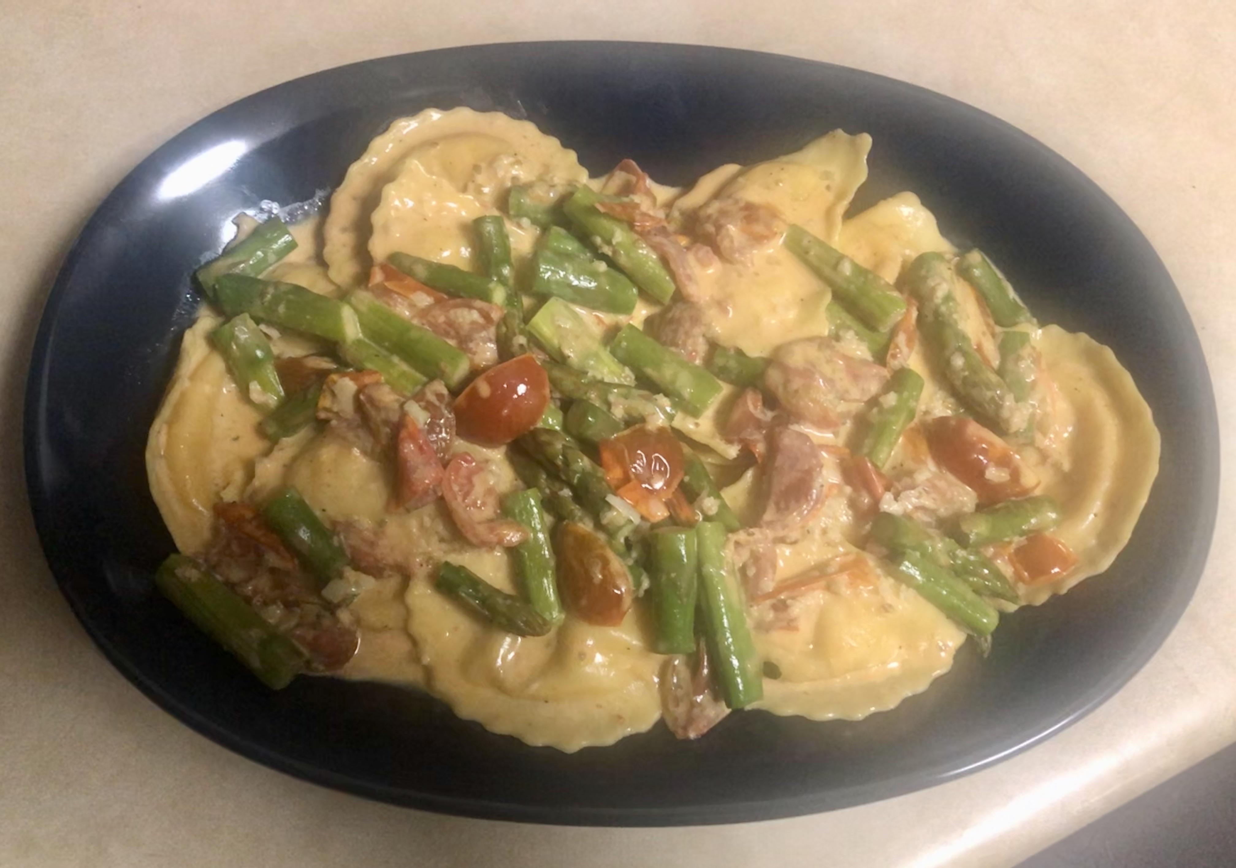 Lobster ravioli with asparagus and tomato cream sauce r/tonightsdinner