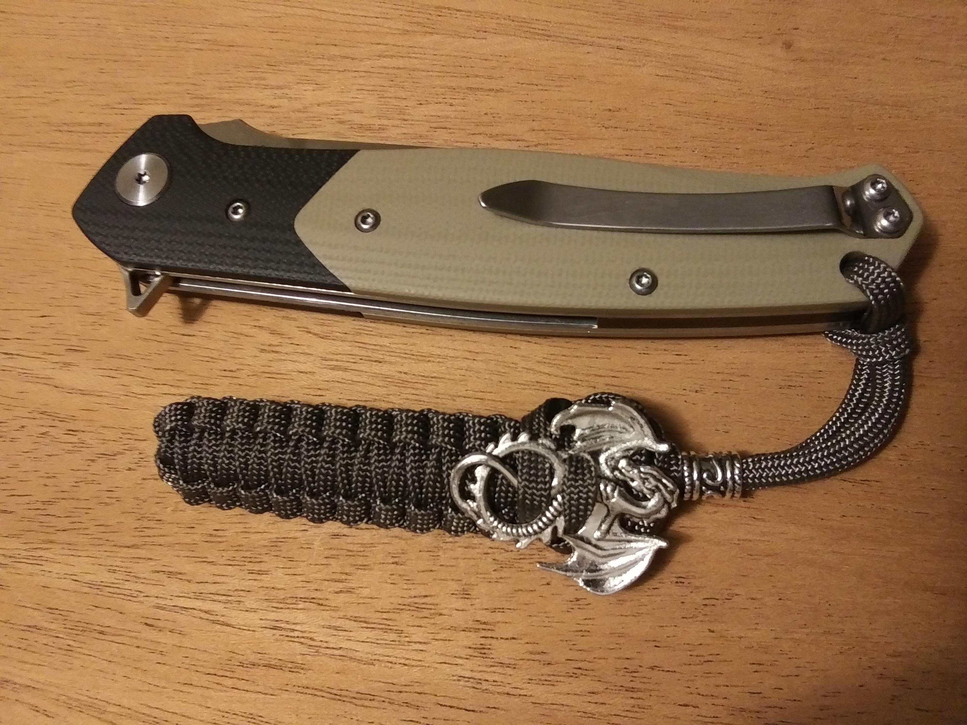 Great knife. D2 blade, sharp as heck. G10 scales. Great deep carry tip