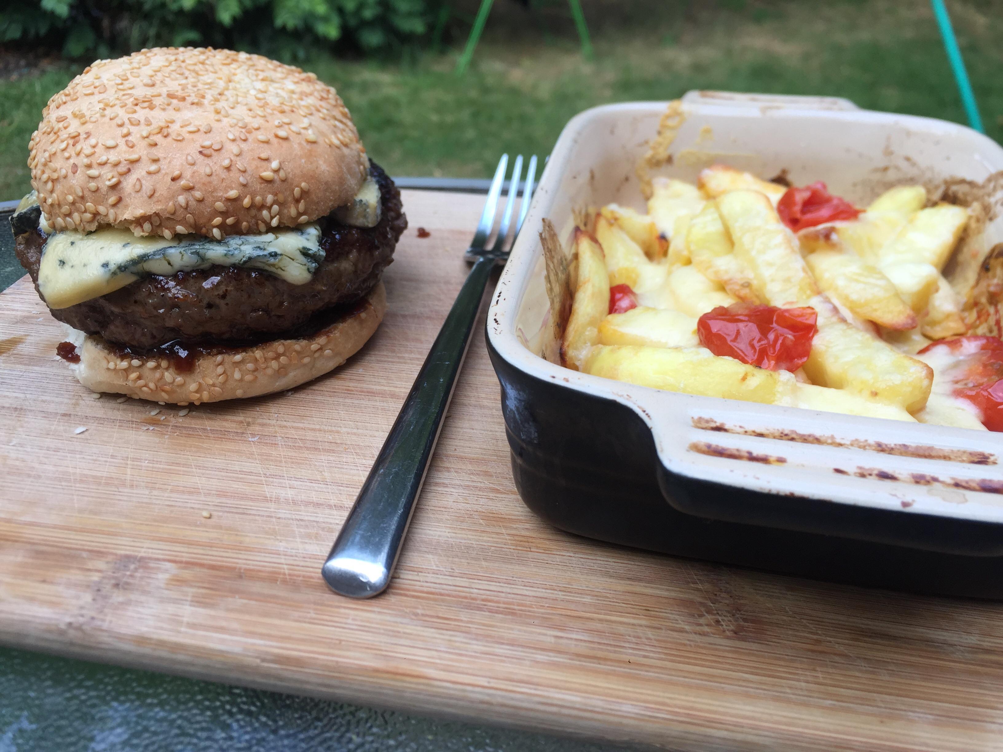 Blue cheese and onion chutney burger served with cheese and tomato