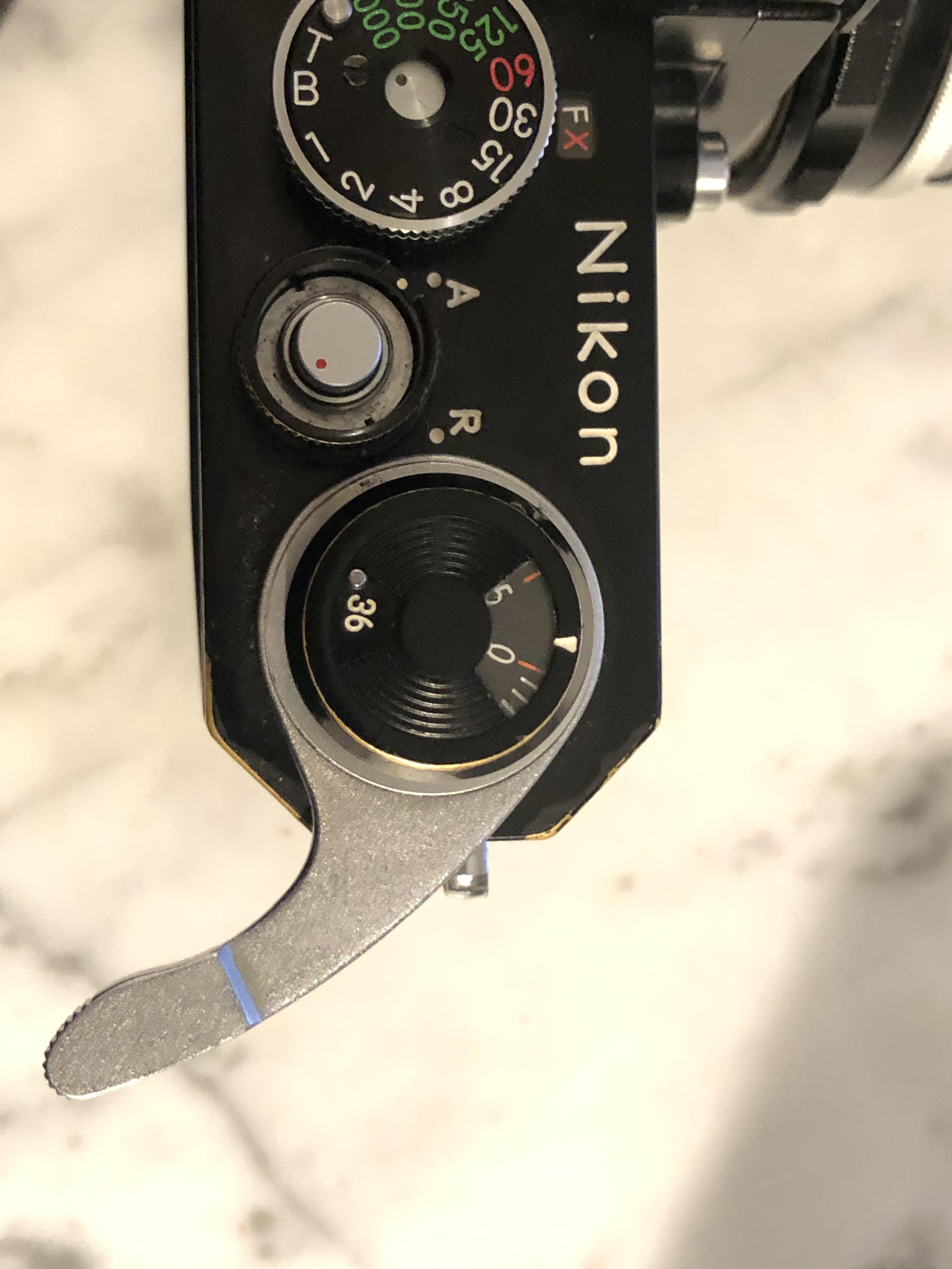 [Nikon F] How do I release the tension on my film advance lever? It’s