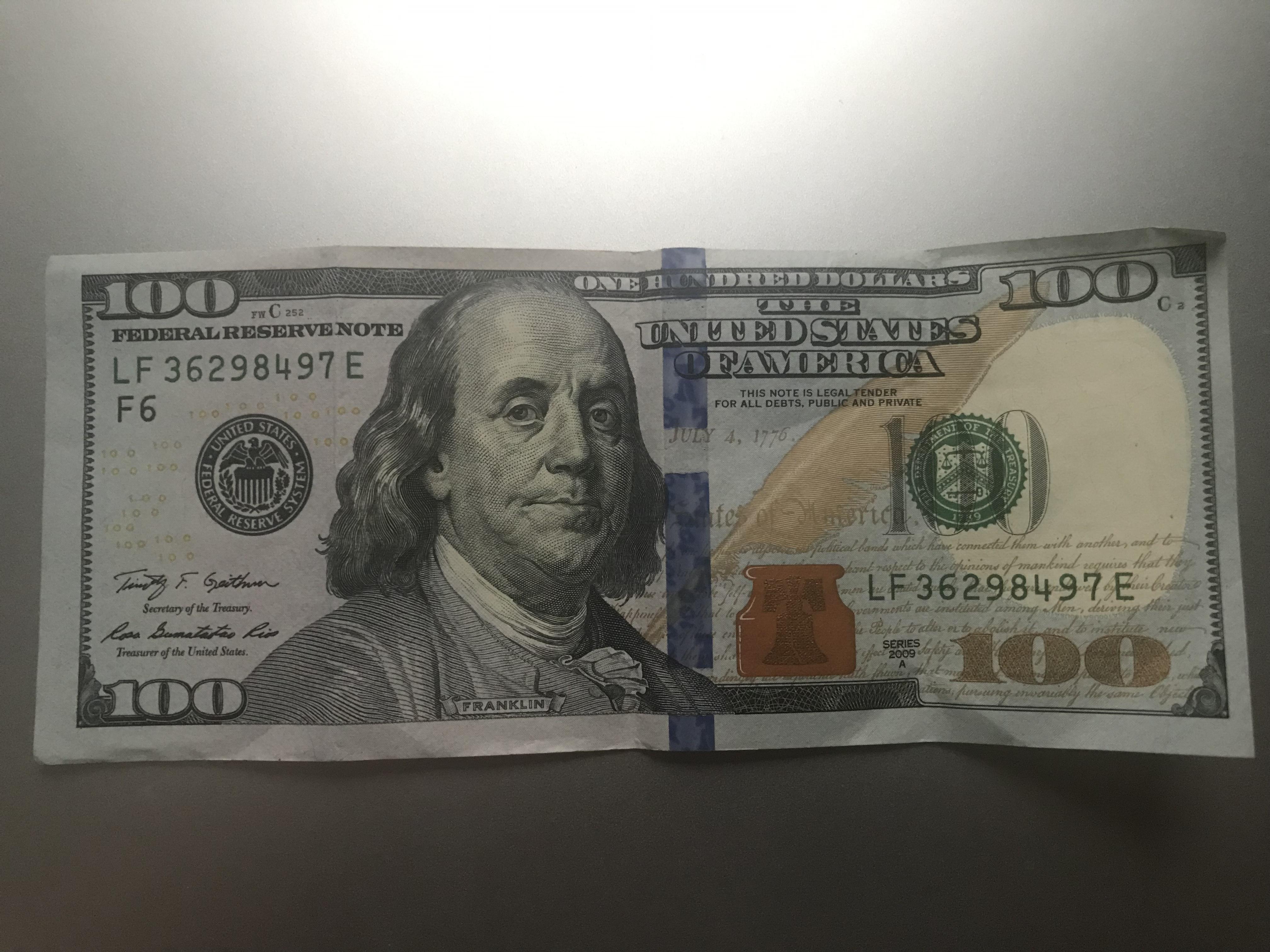 Value of 100 bill with security strip cuts slightly off r/uspapermoney