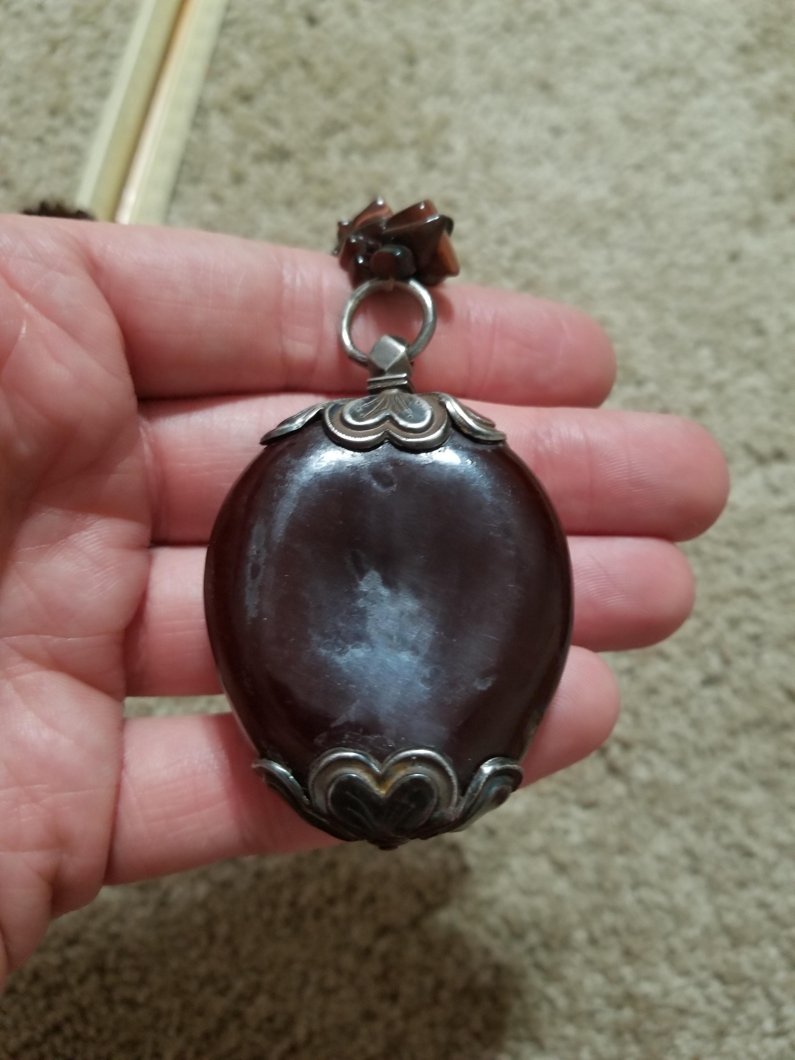 Strange vintage necklace pendant? What is it made out of? r
