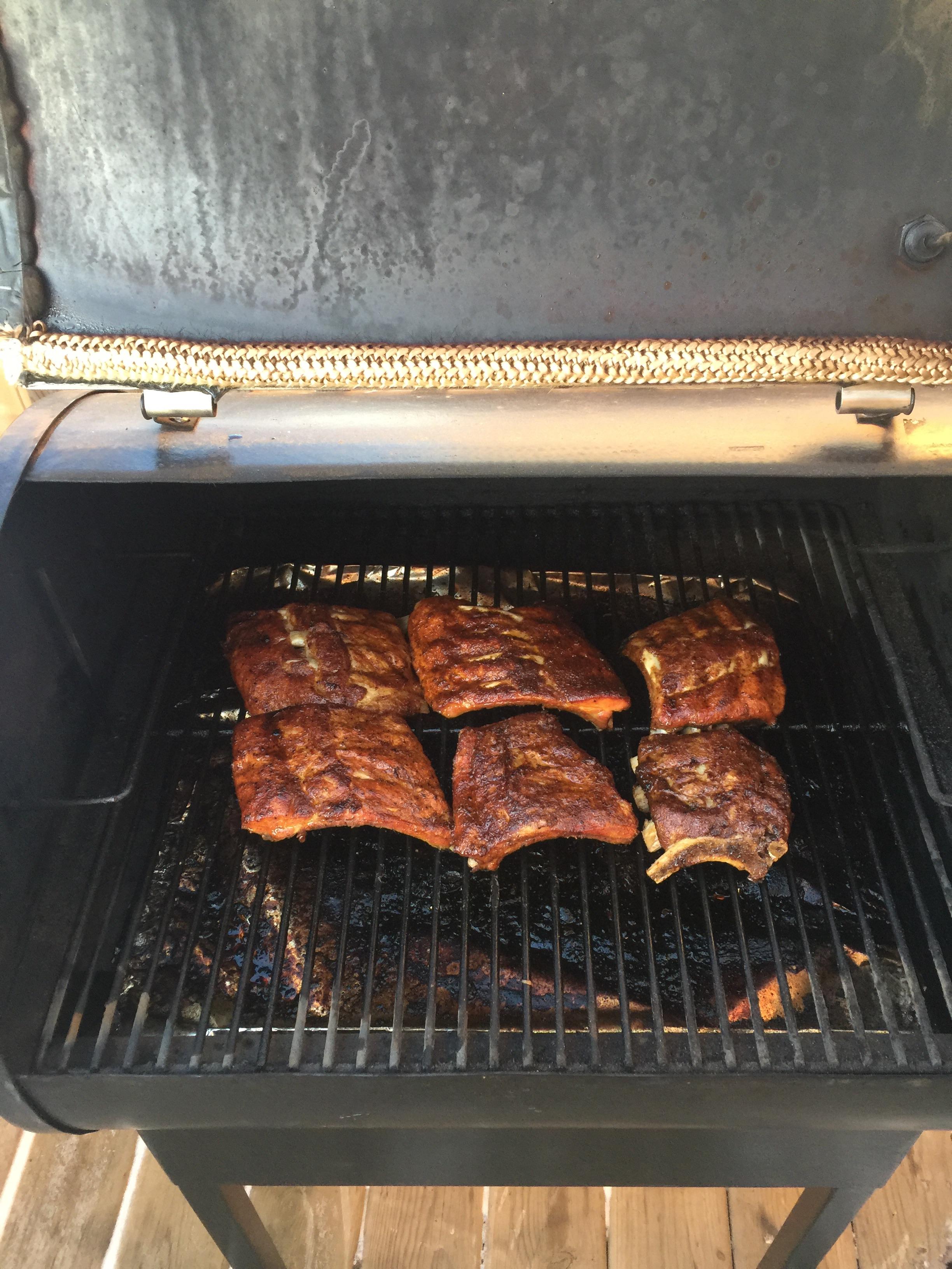 Ribs smoking on my Traeger. 31C ambient temperature r/grilling