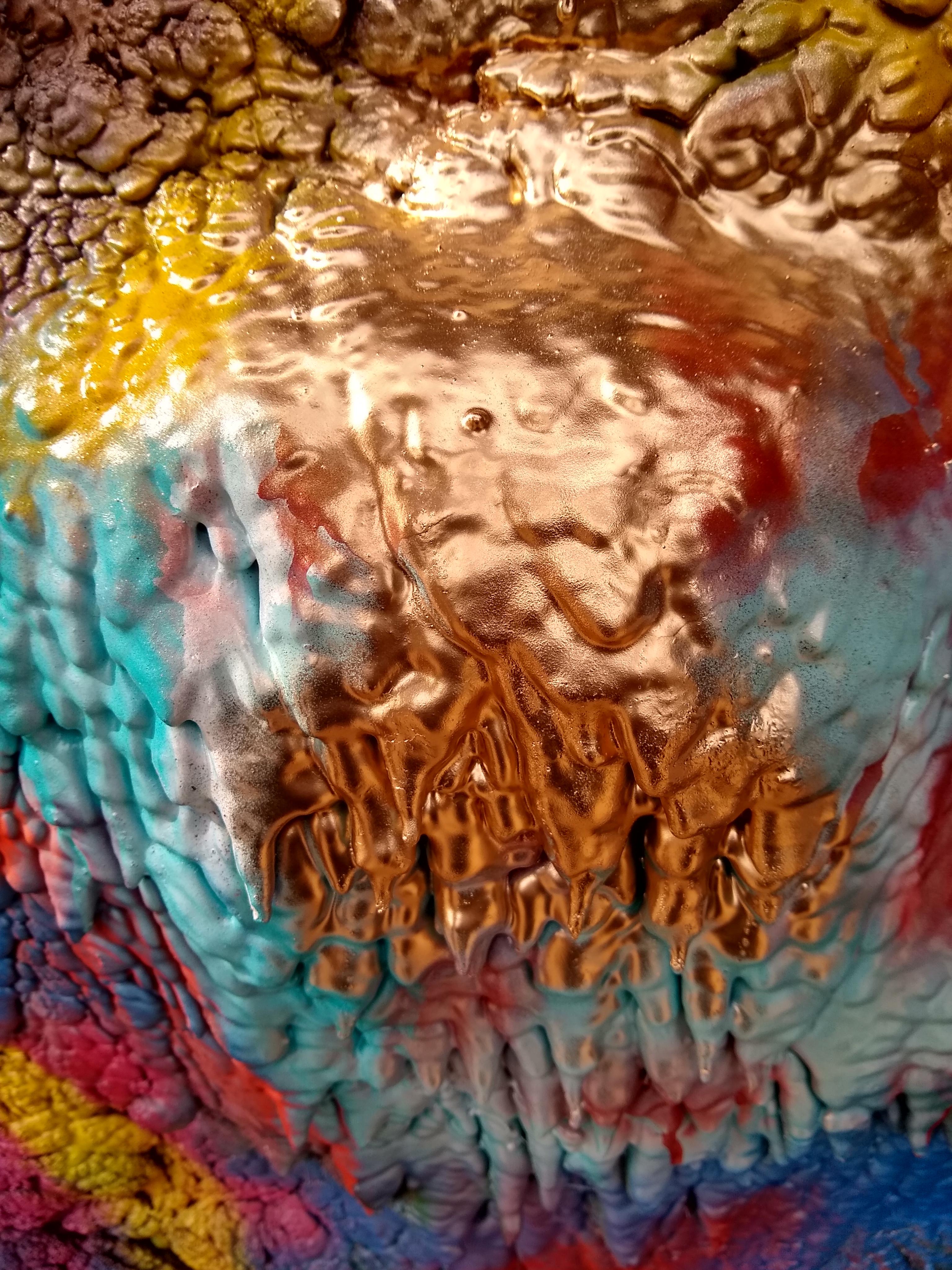 Layers of spray paint spanning years on one of the cars at Cadillac