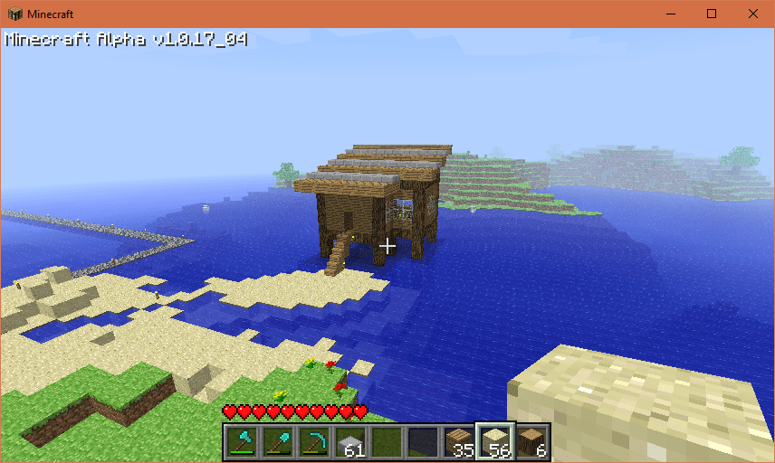 A tiny beach house on stilts with a flat plane roof. Stone slabs