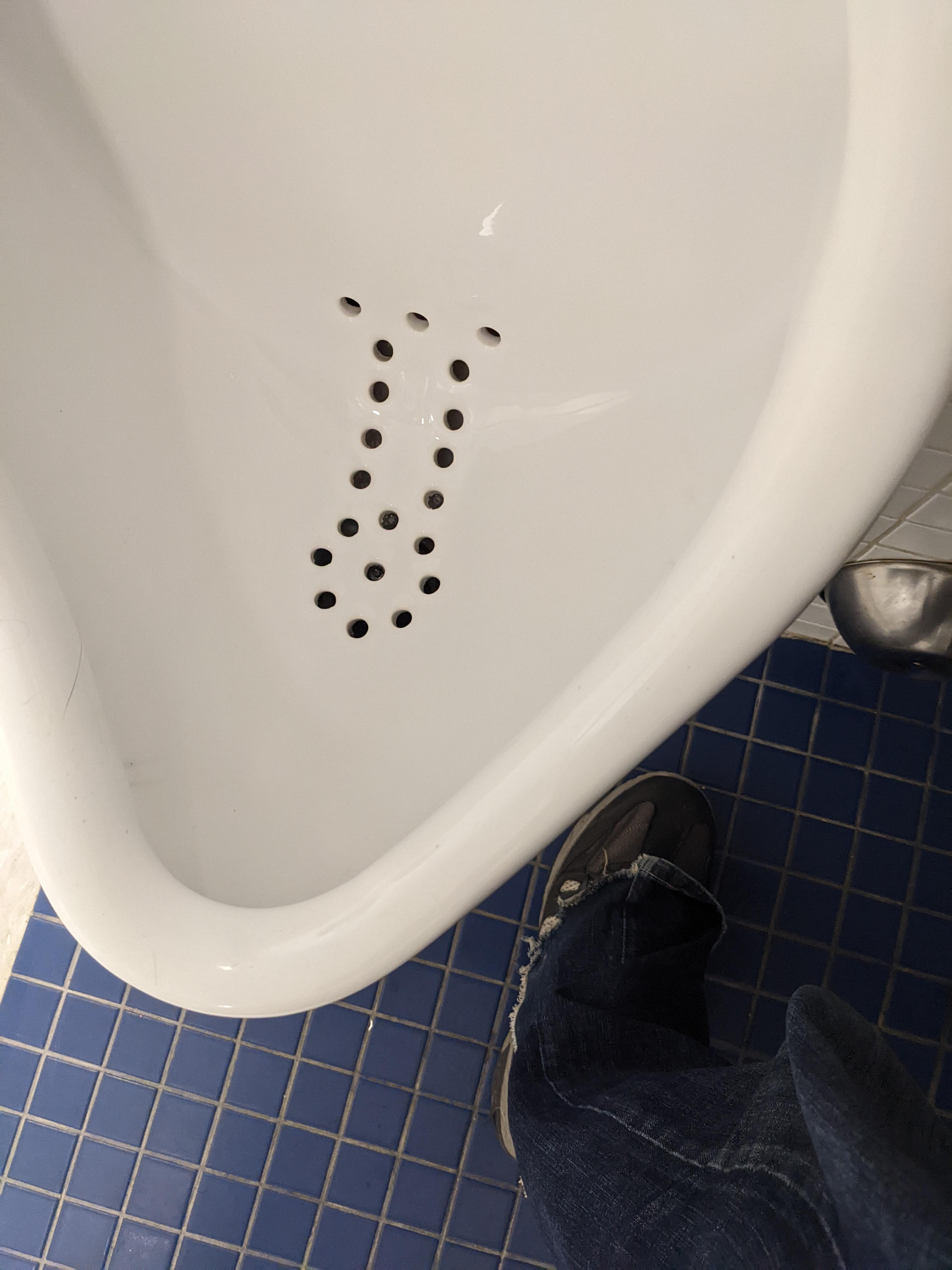 These drain holes in the urinal mildlypenis
