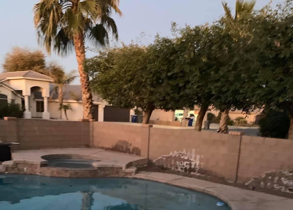 Anyone know how to remove this white stuff on my walls? It’s also on my pool deck a bit, seems