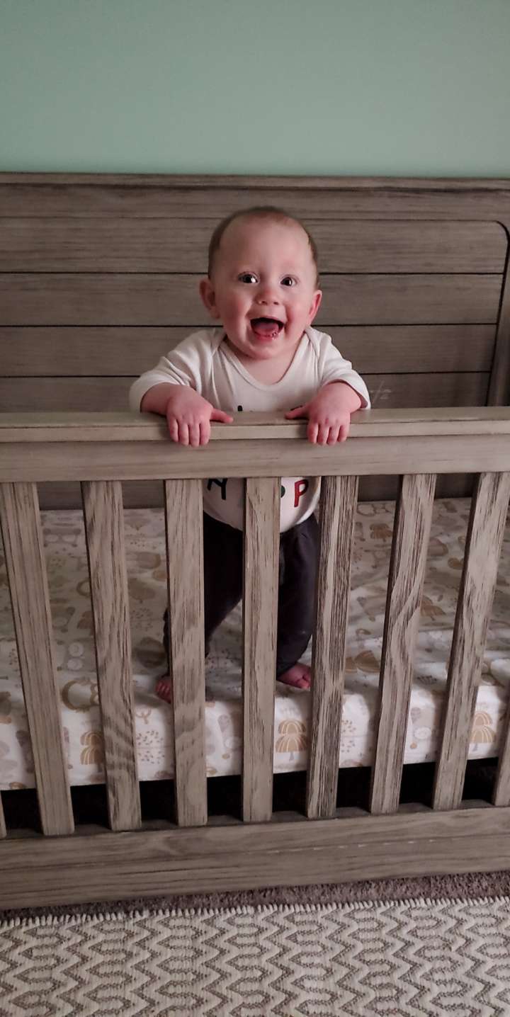 My son learned to stand on his own with a little crib support. Jumping