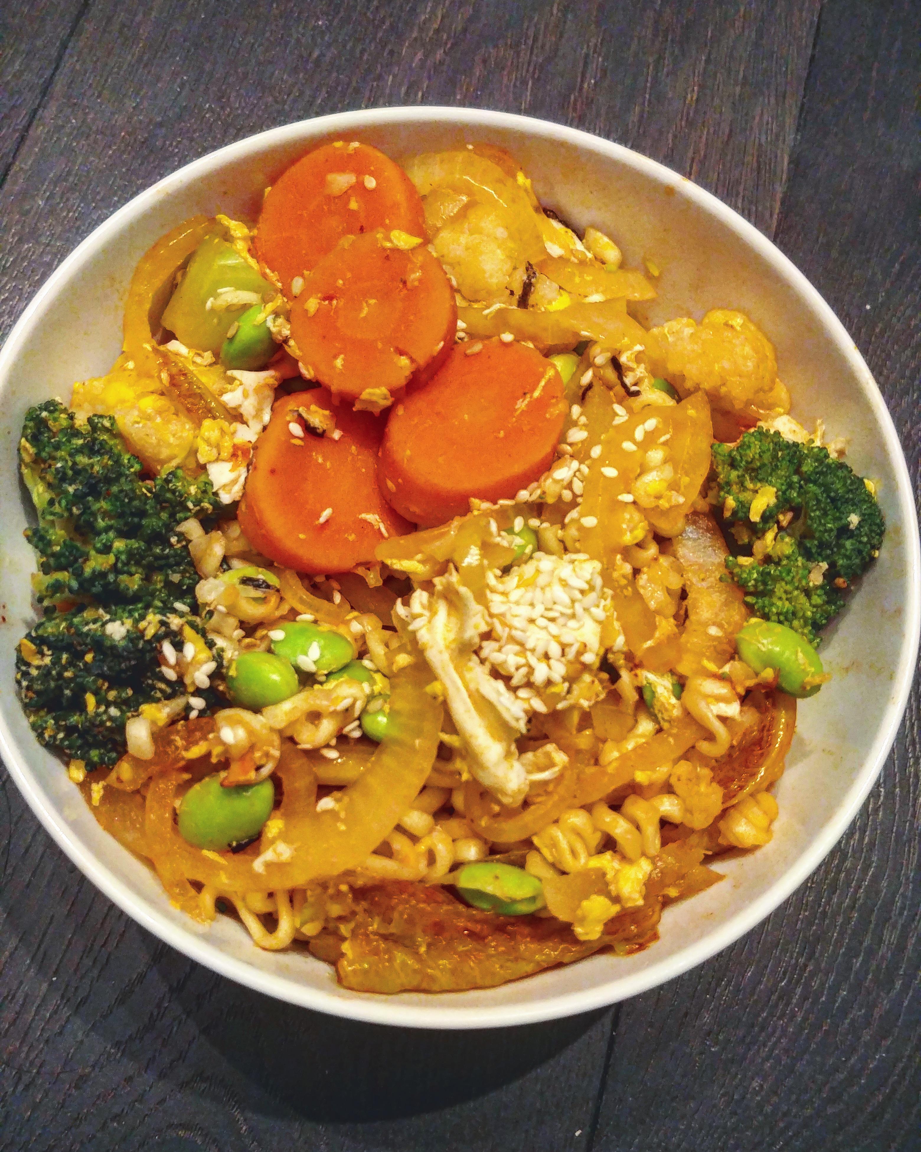 I spiced up some ramen with some frozen vegetables, a poached egg, and