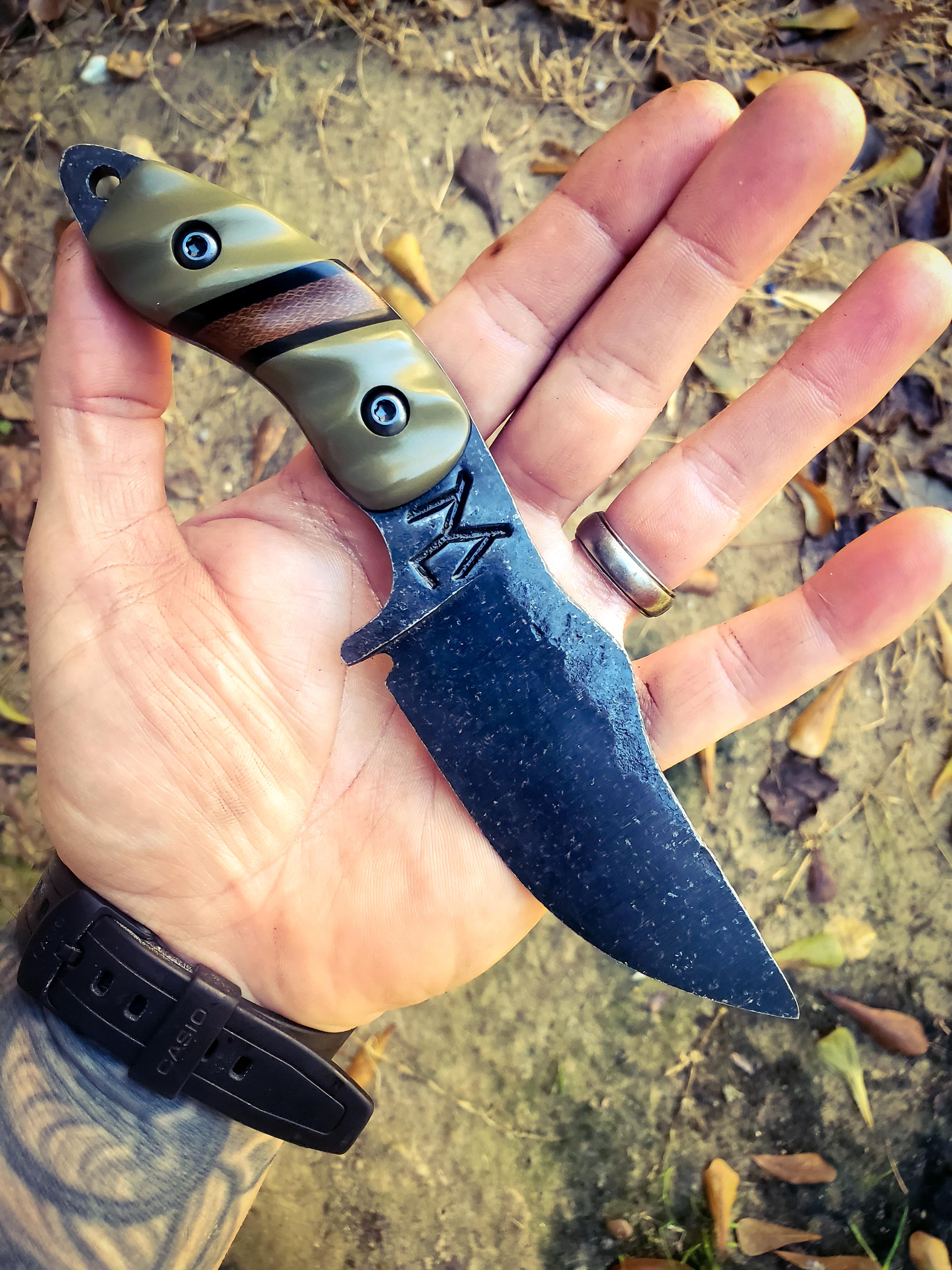 80crv2 with OD green G10 and black G10 liners with a Dark brown Micarta