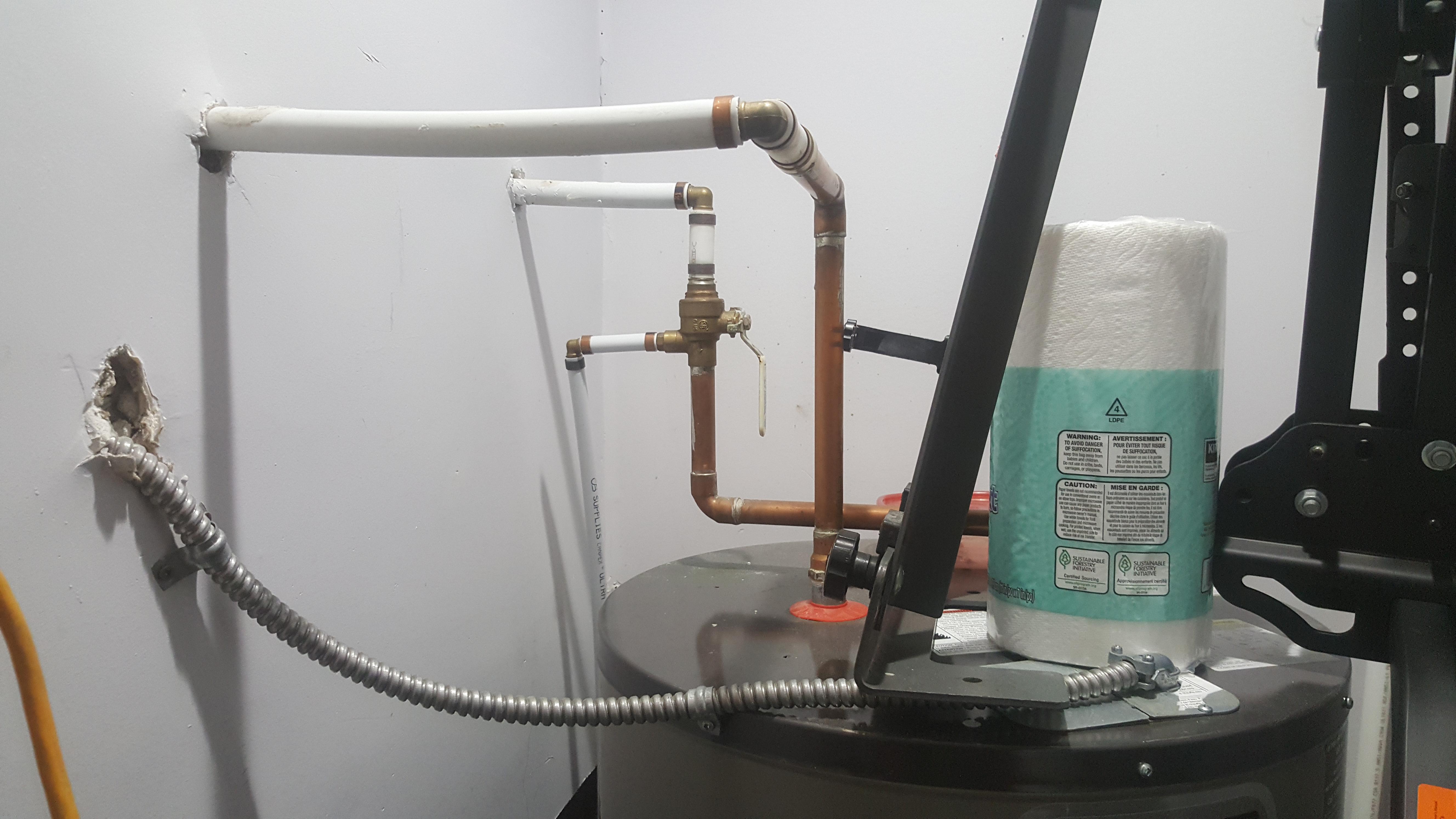 I have a question about why my hot water tank is running water out the tube leaving the shutoff