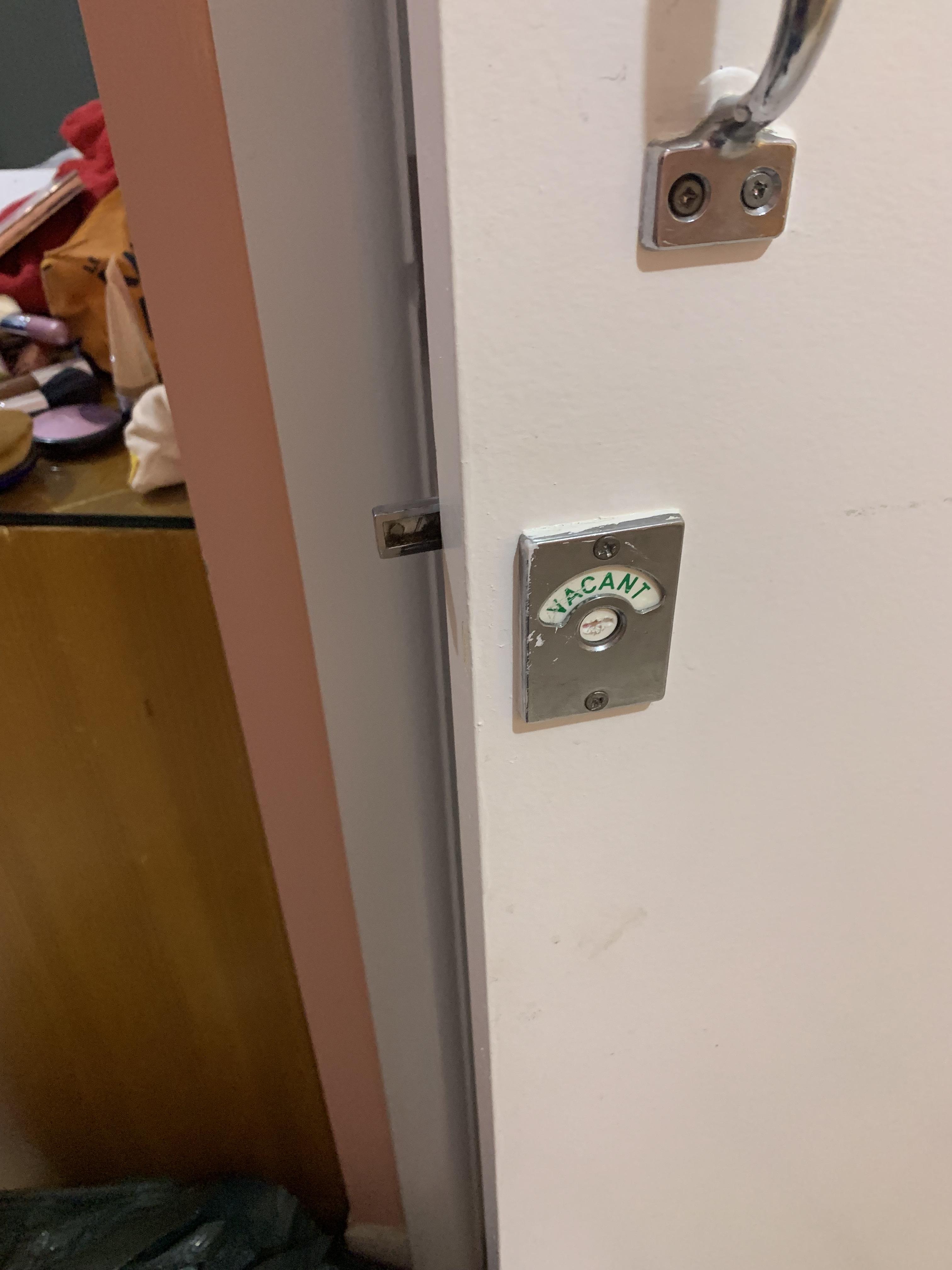 Toilet door says vacant when locked and occupied when unlocked r