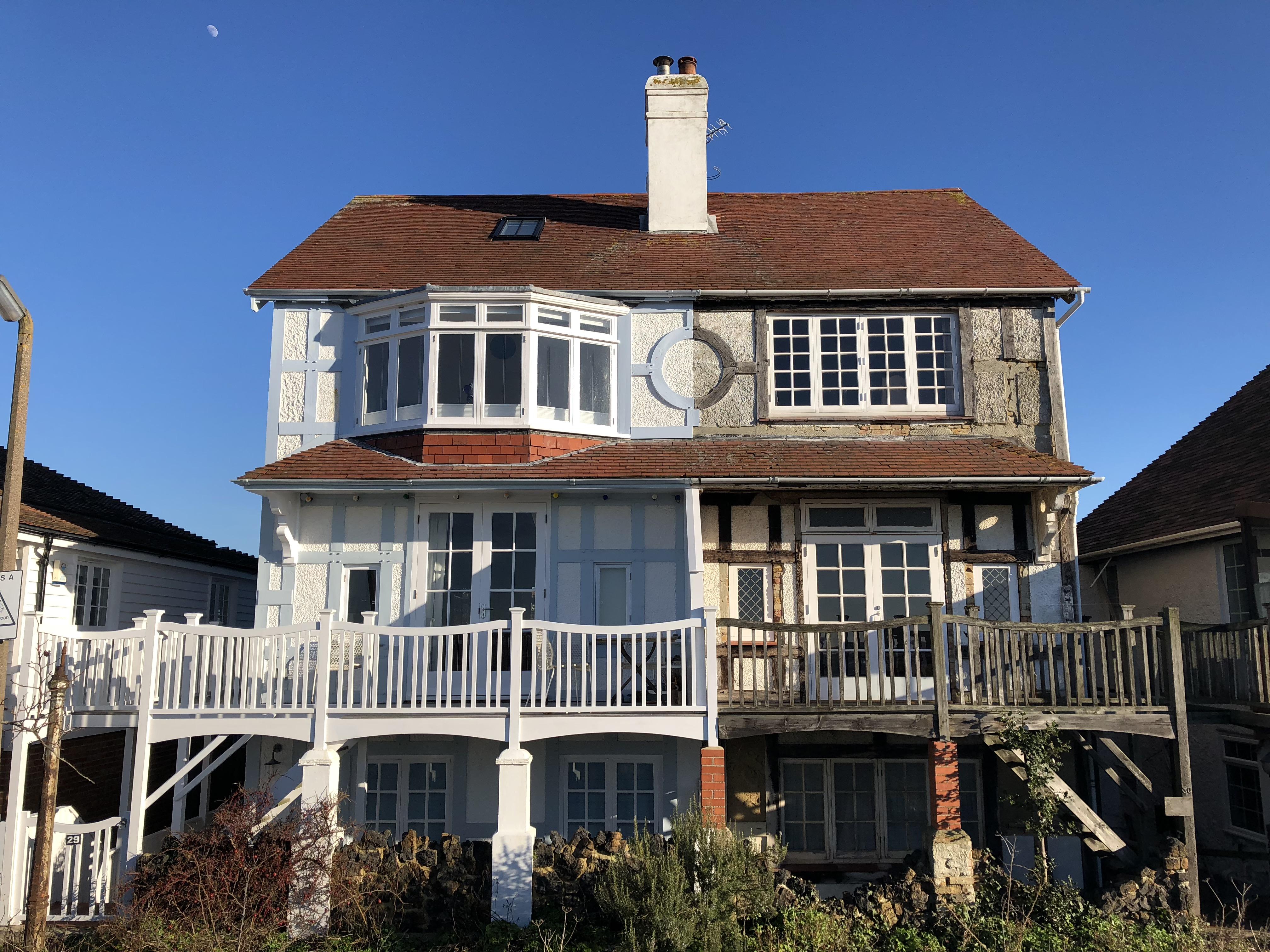 Same house, different stories. Whitstable beach front, UK. [building