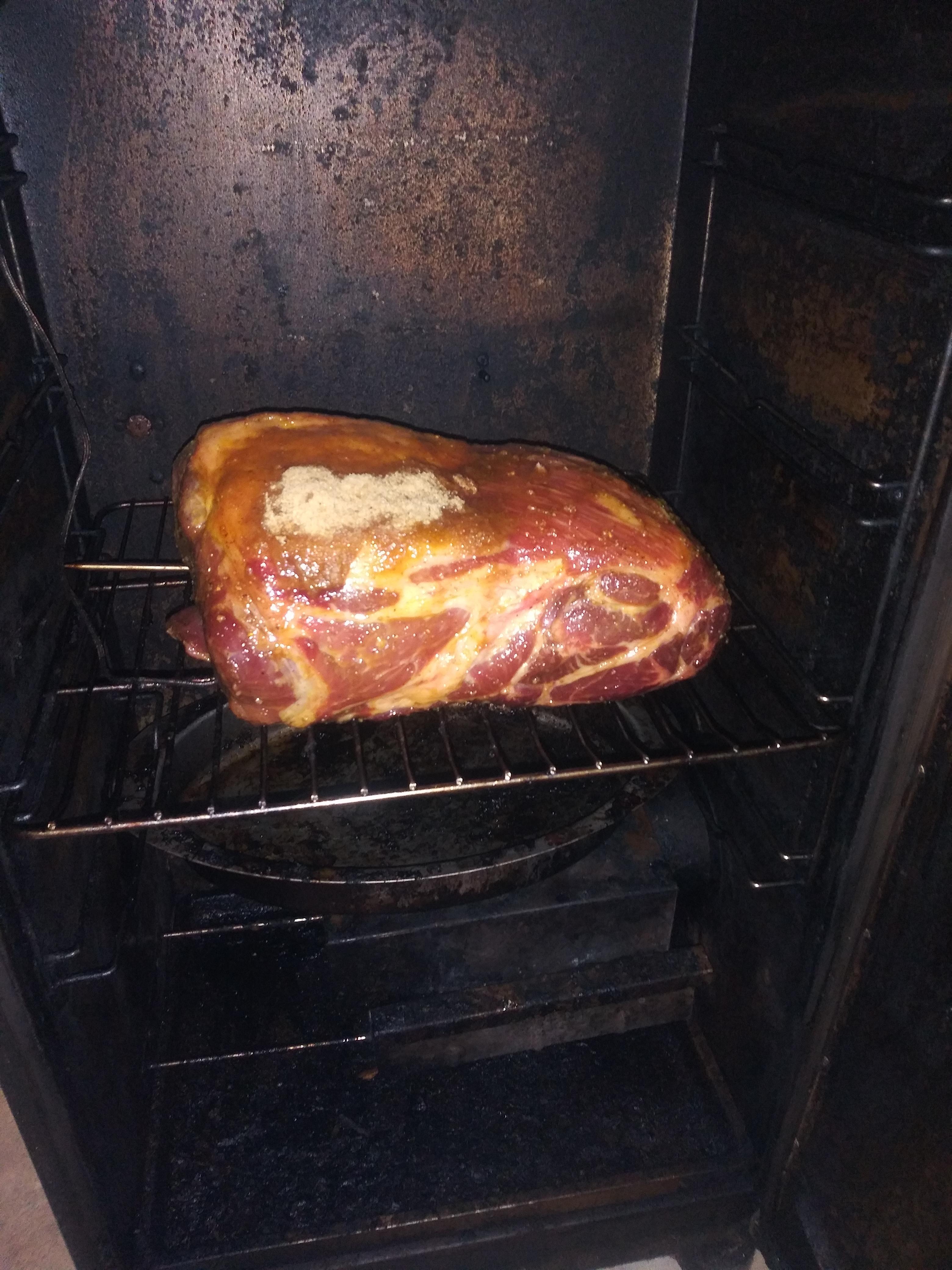 7 Pound pork shoulder, fat side up, cooking at 230 degrees for pulled