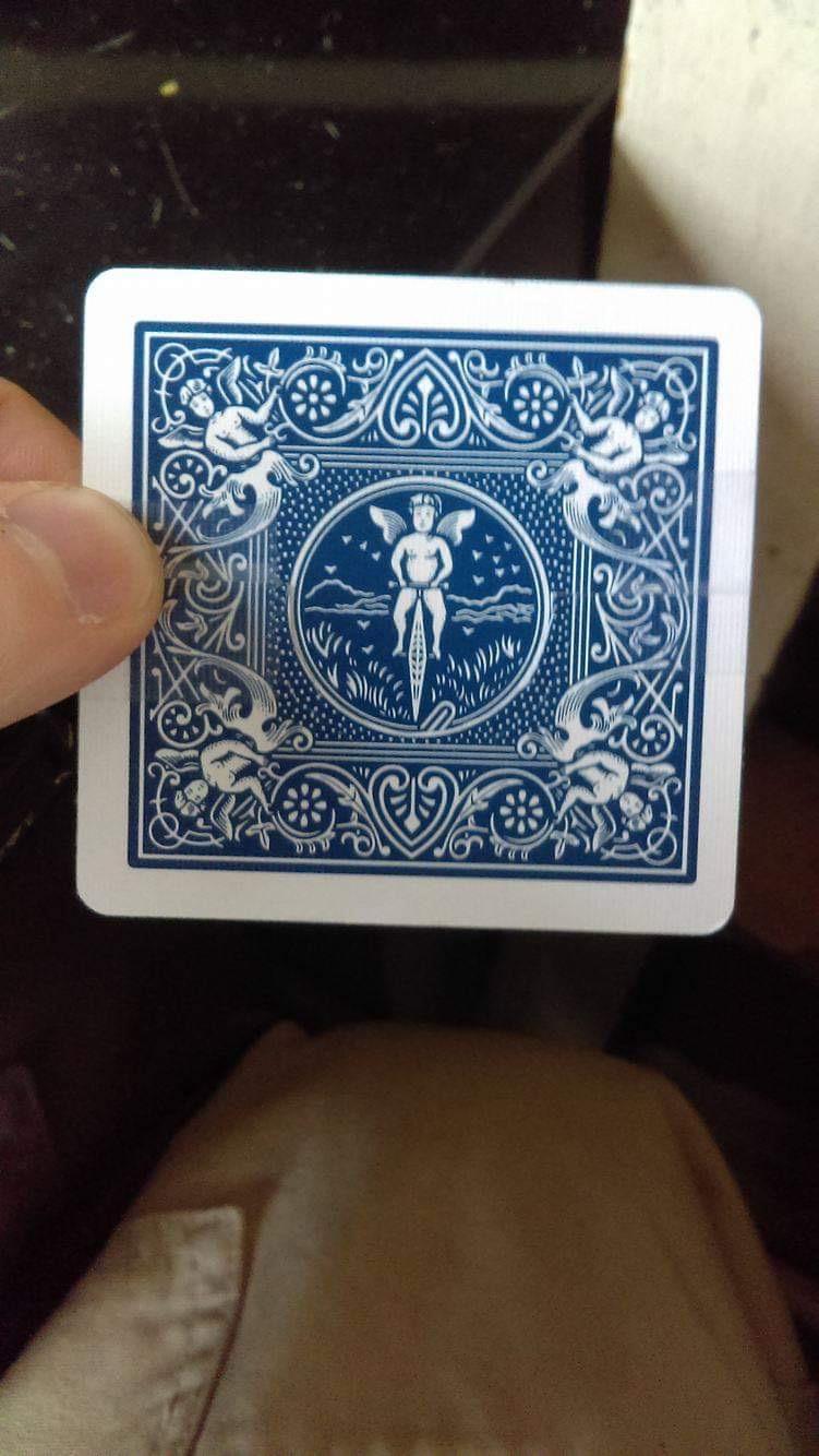 I cut a bicycle card in two and taped it together to form one cyclist