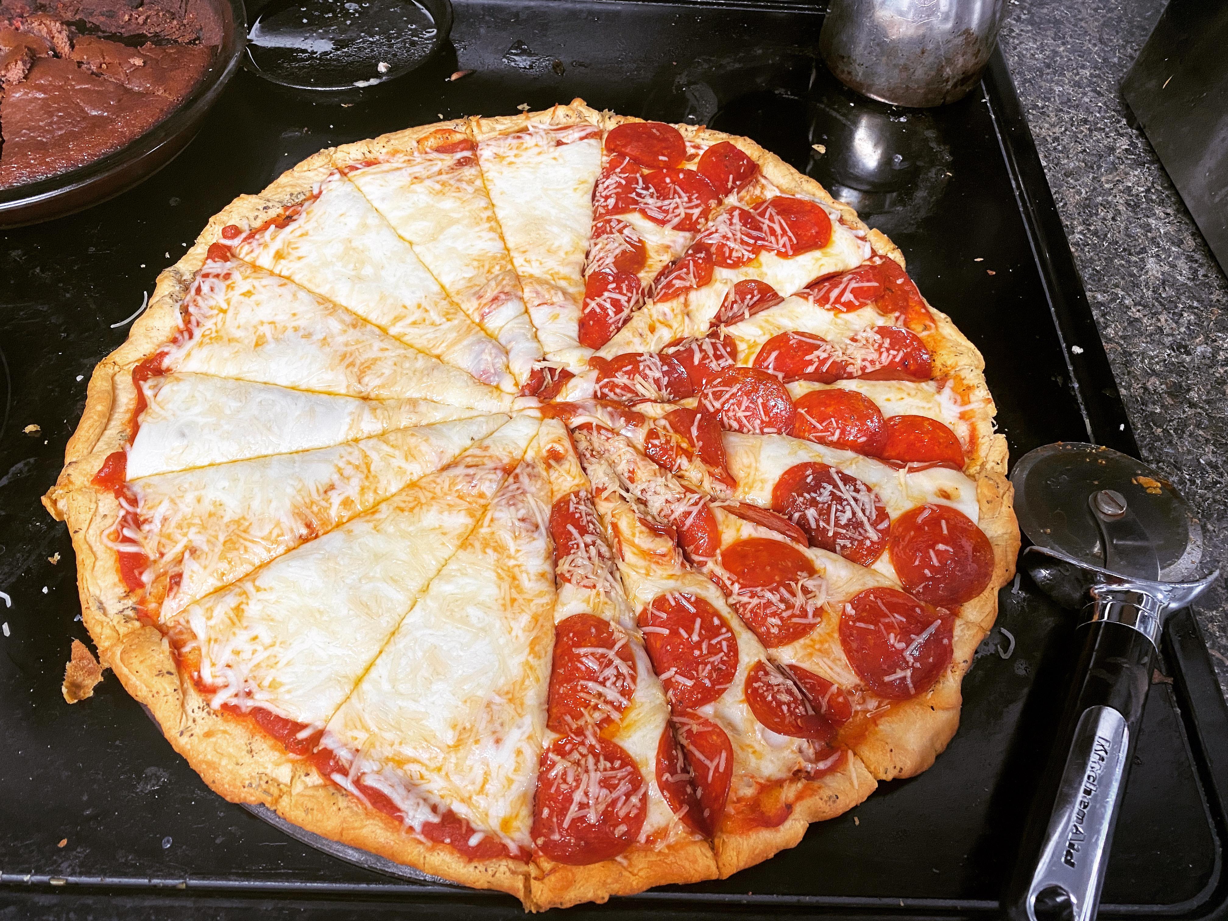 [Homemade] One large 3 cheese and half pepperoni pizza. r/food