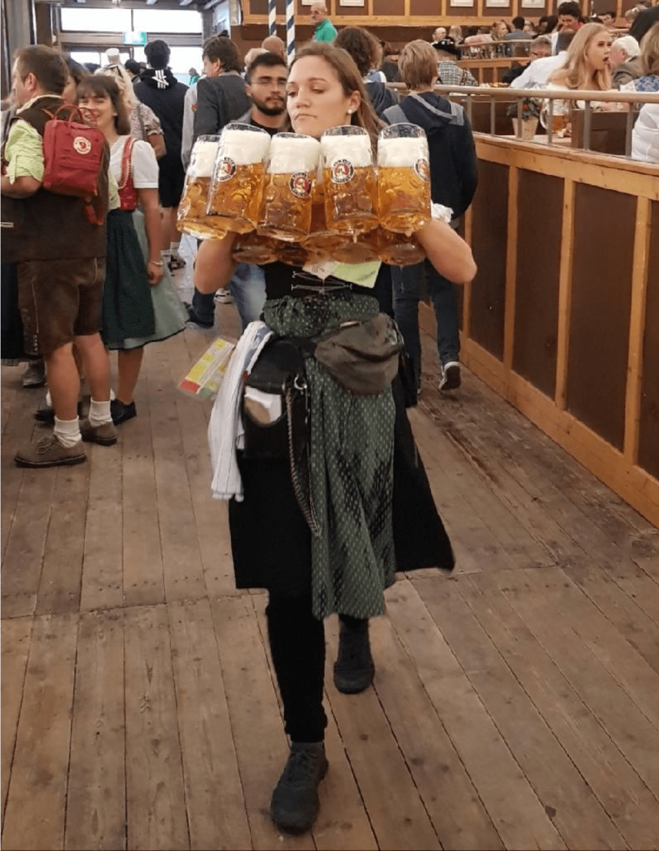 Waitresses Oktoberfest carry up to 18 beer mugs at once That's 41 kg