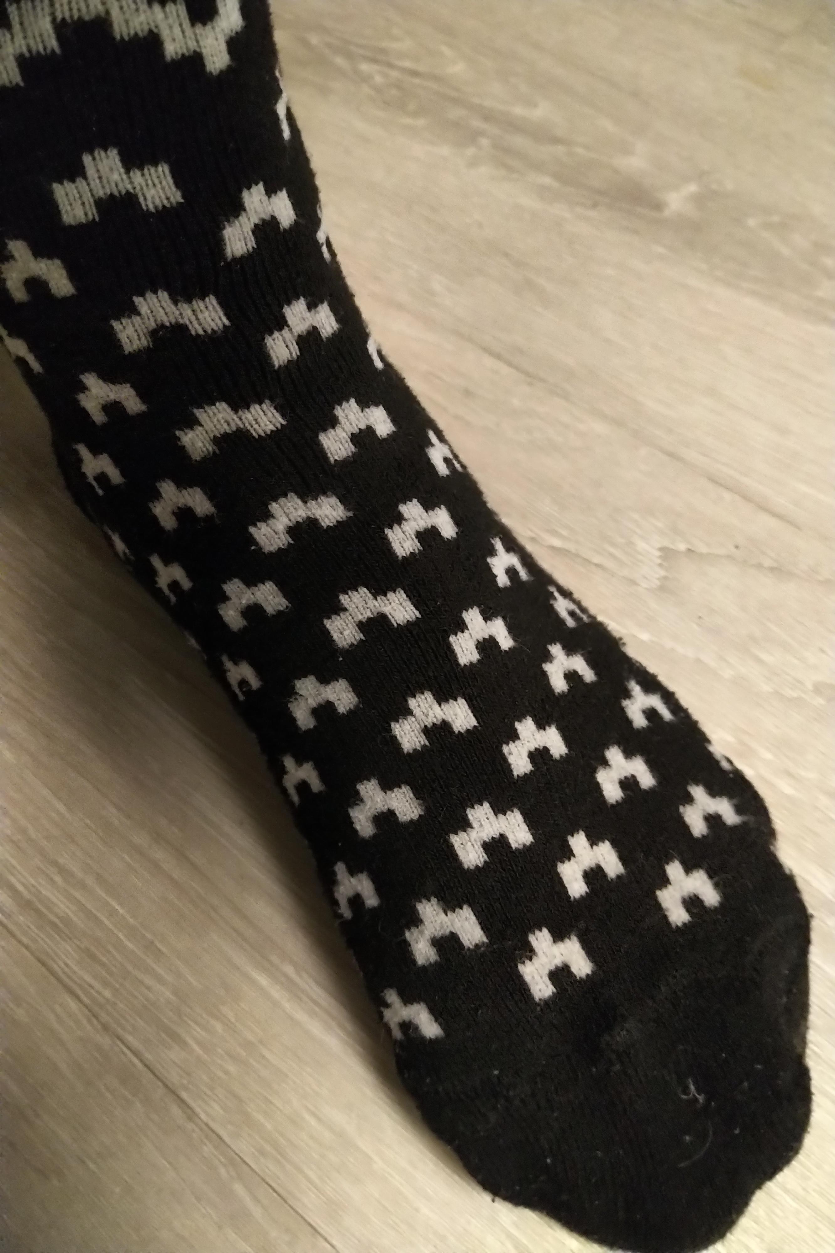 Just noticed the design on an old pair of socks... r/blackmirror