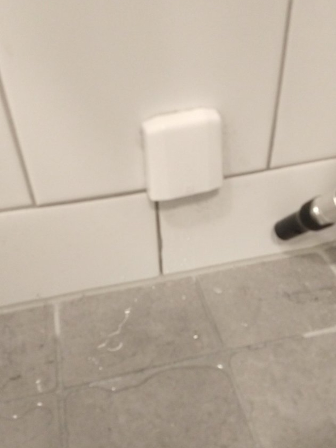 Help! This white thing on the wall in my bathroom is leaking water