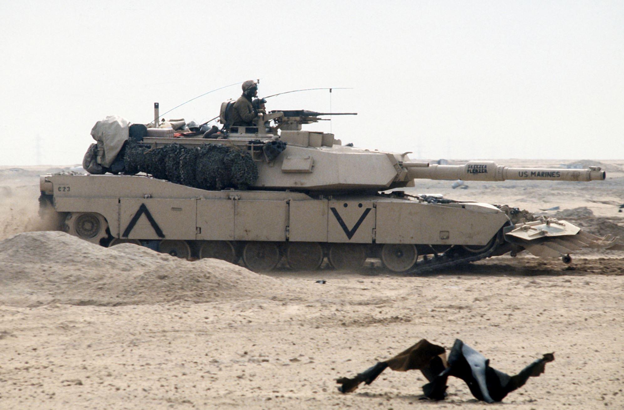 One of the first USMC M1A1s in action during the Gulf War- a present