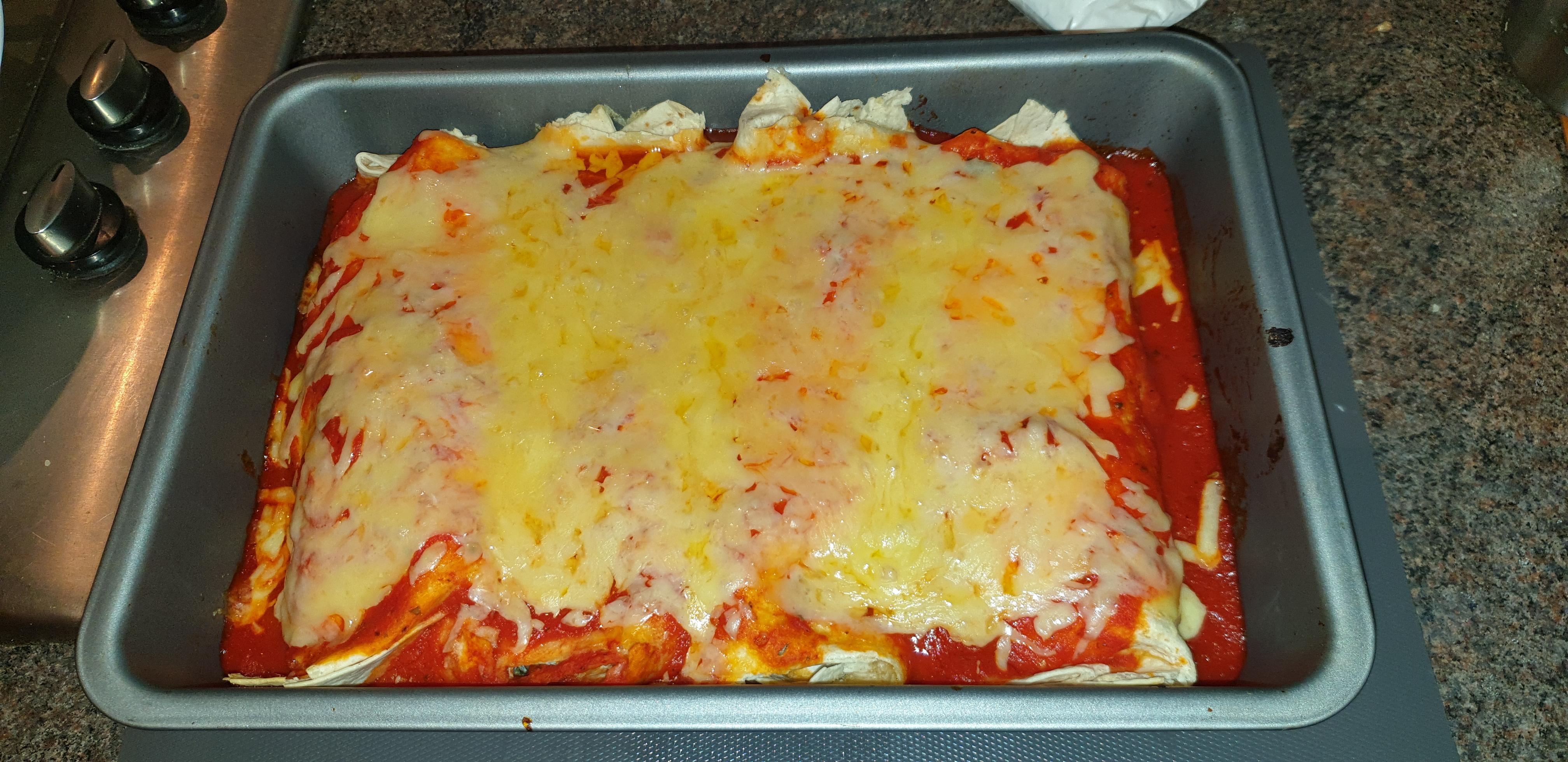 Enchiladas with beans, peppers, ricotta cheese ad spinach filling. r