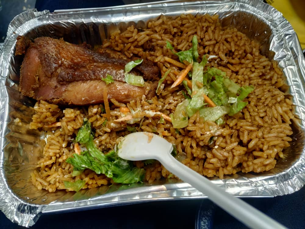 Ghanaian Jollof Rice with Fried Chicken and a small salad Central