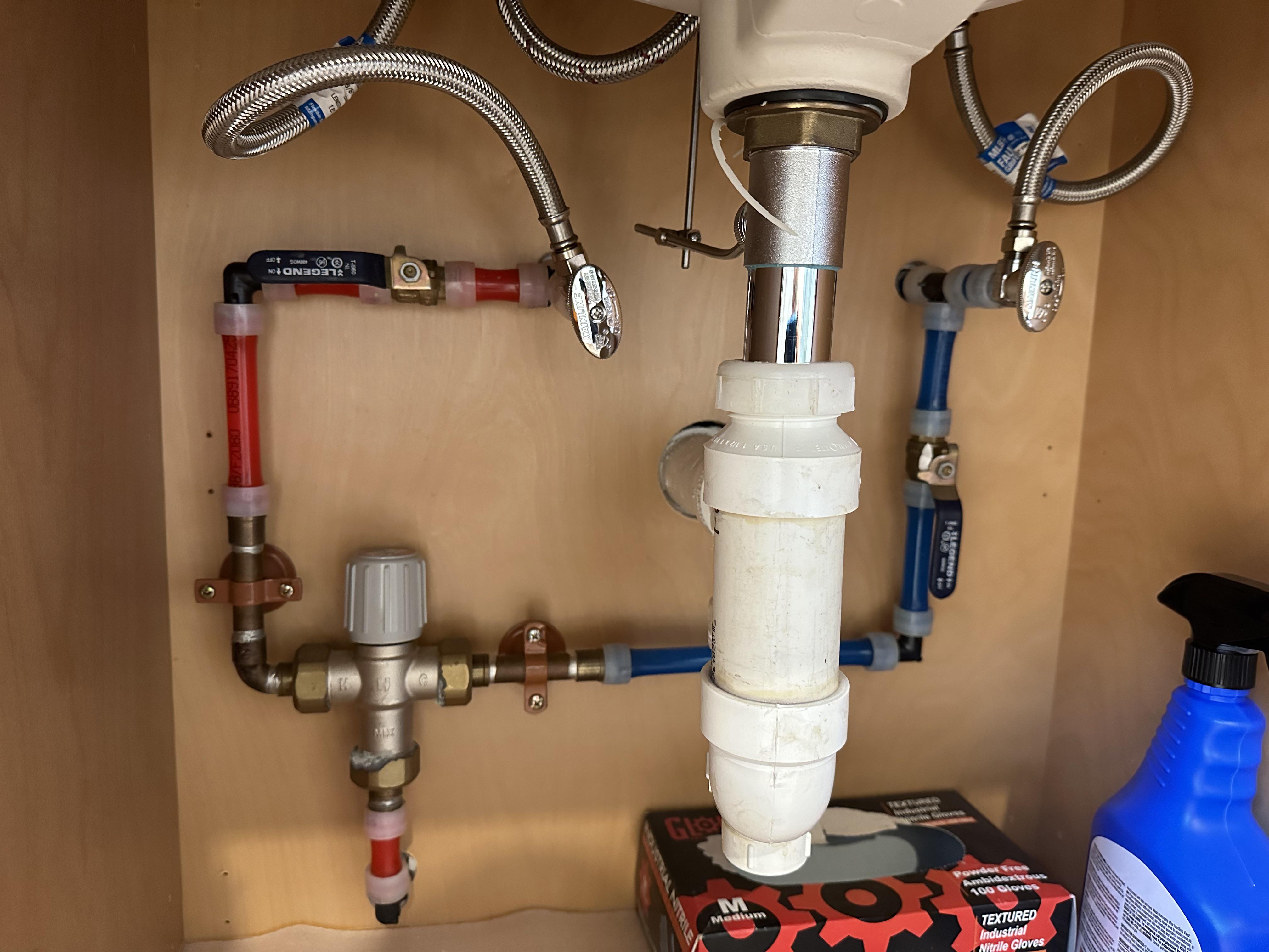 Found a mixing valve under the master bath sink four years later! : r