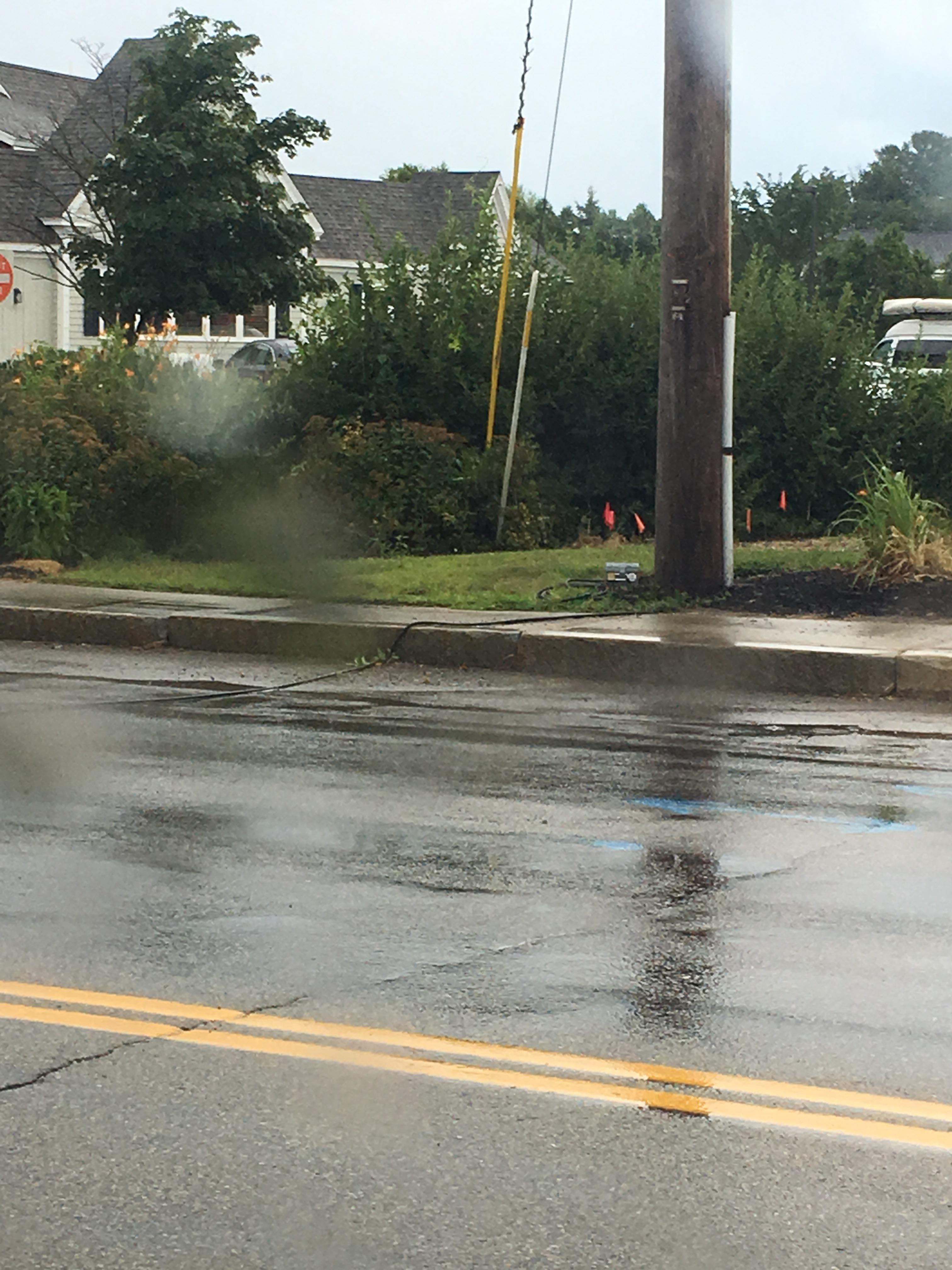 Little gray boxes with wires that go across the road, all over town
