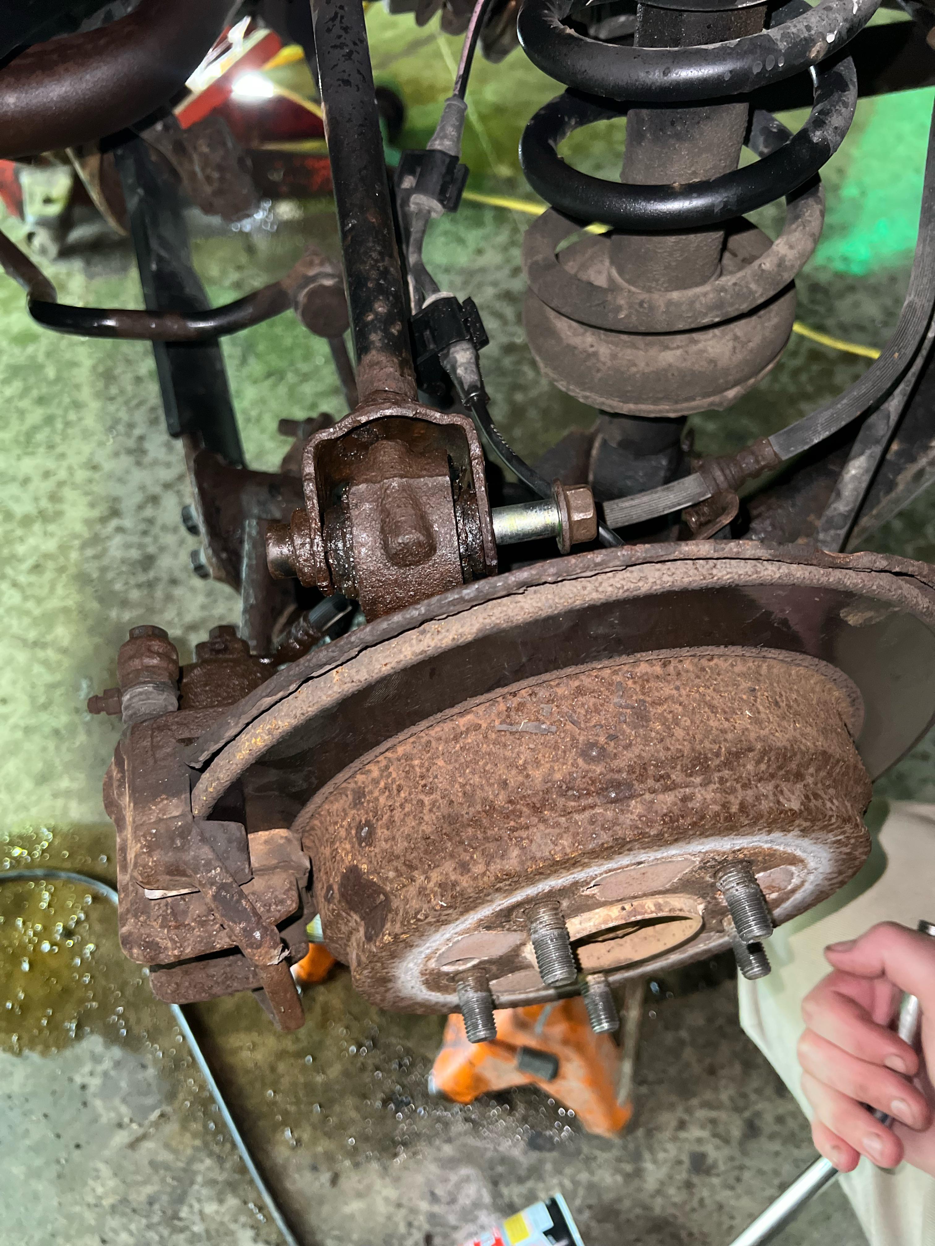 How do I get this screw off? 2005 Honda CR-V. Steering knuckle : r