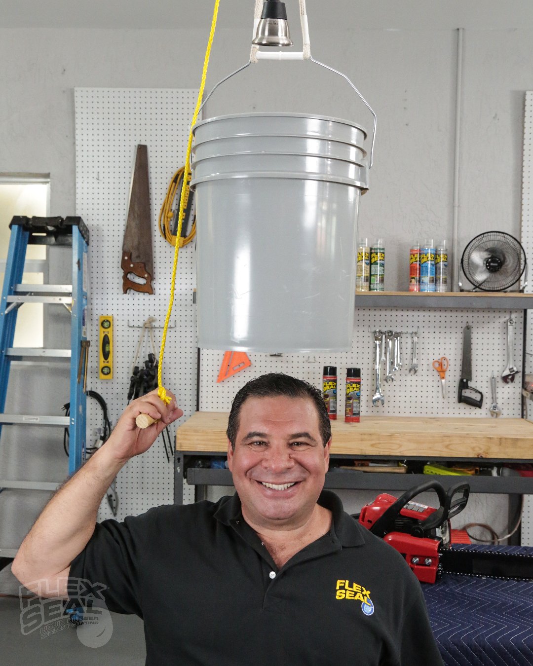 PsBattle Phil Swift holding a bucket over his head