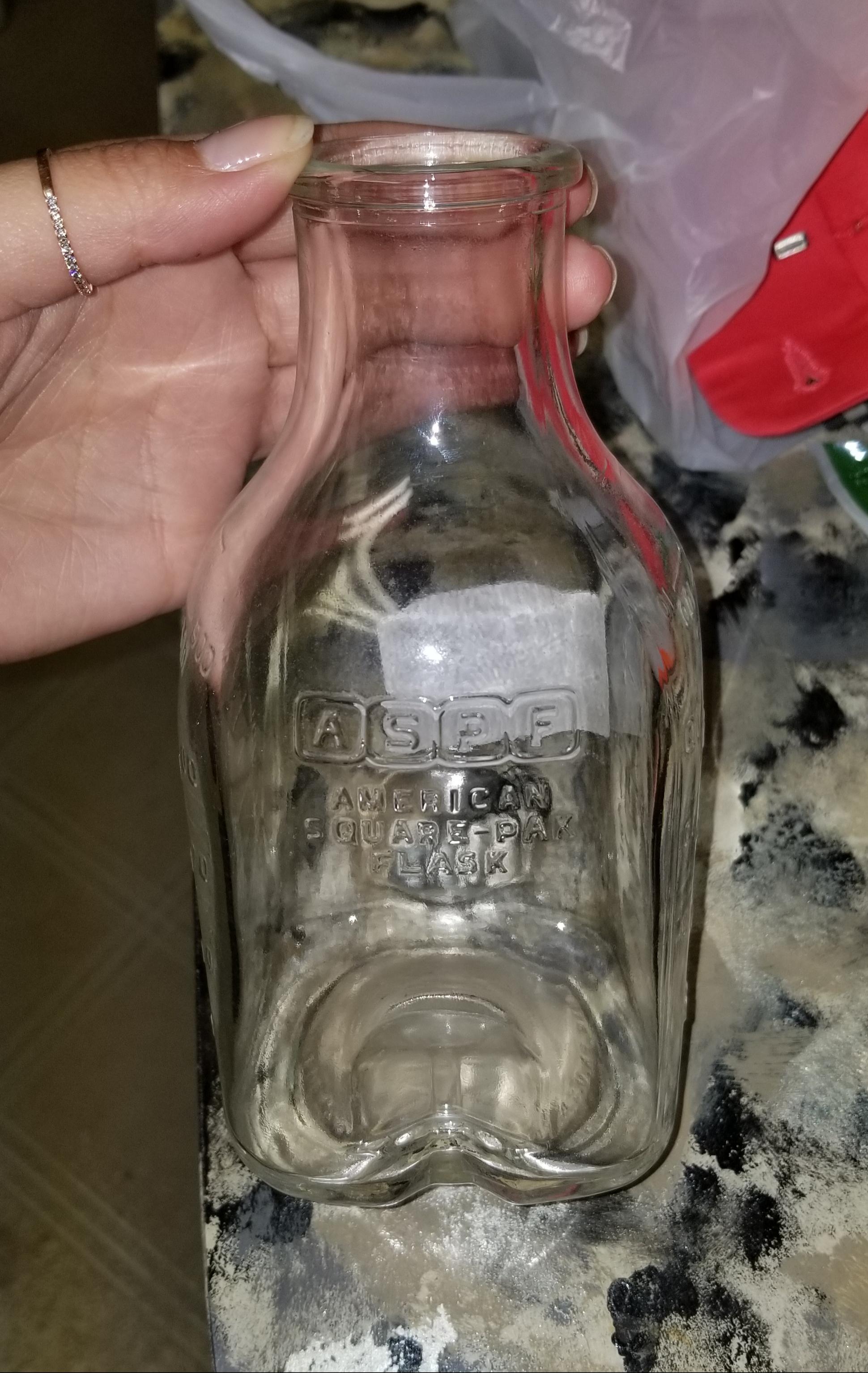 Found this old glass IV bottle at Goodwill for only .69. The bottom is