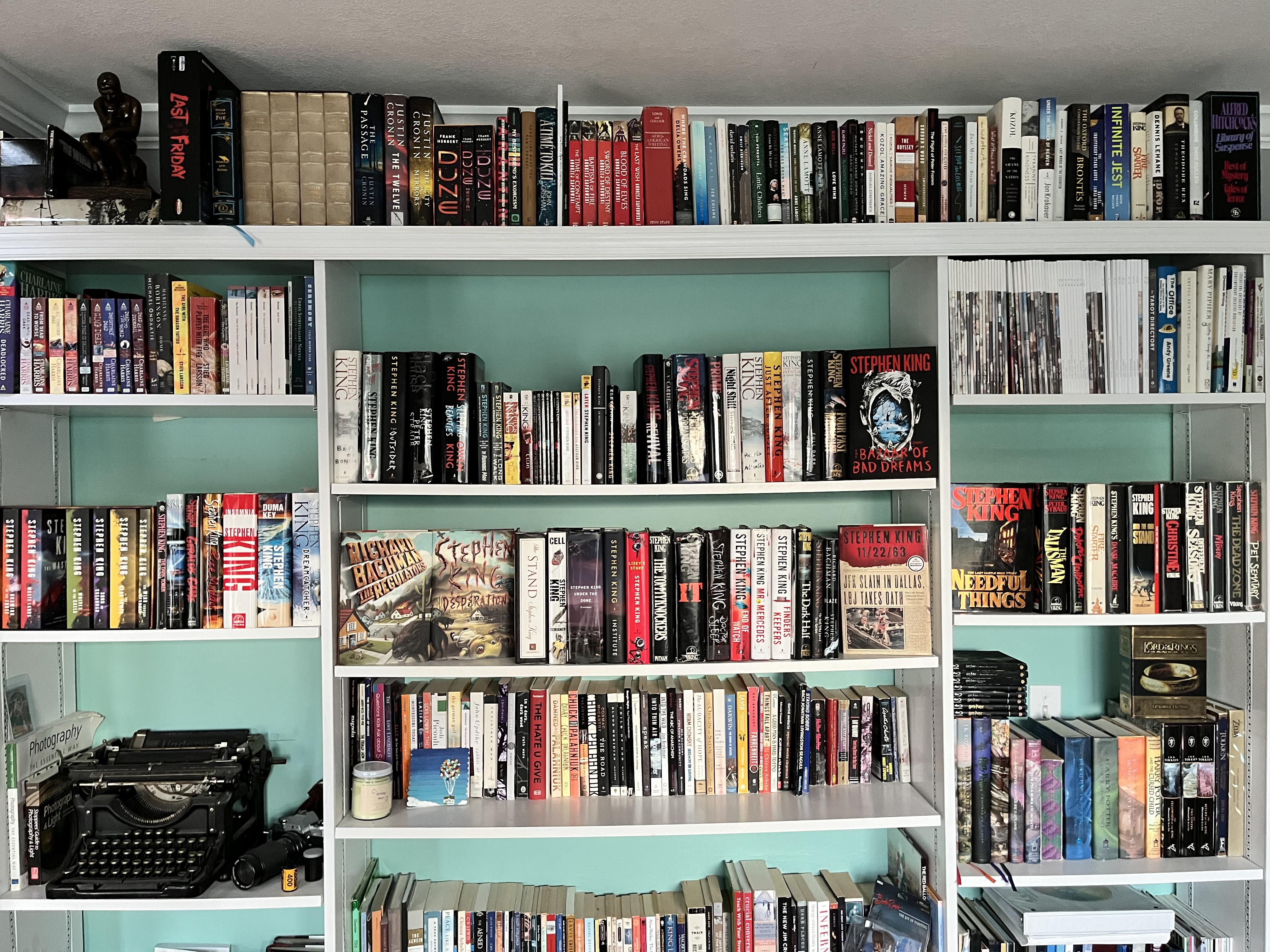 Built these shelves. King is slowly taking them over. He has four full