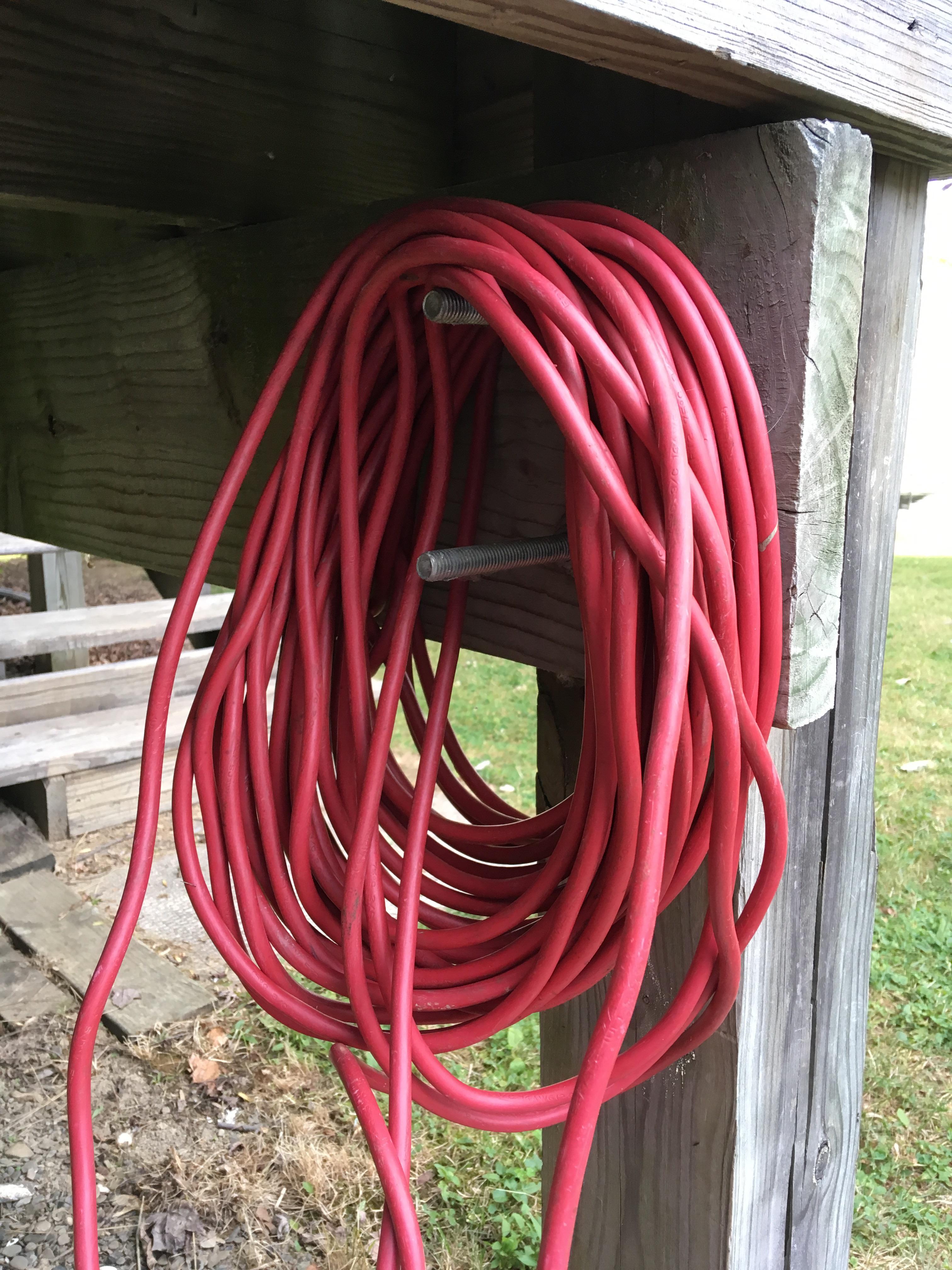 Hang an extension cord from extra long deck bolts : r/lifehacks