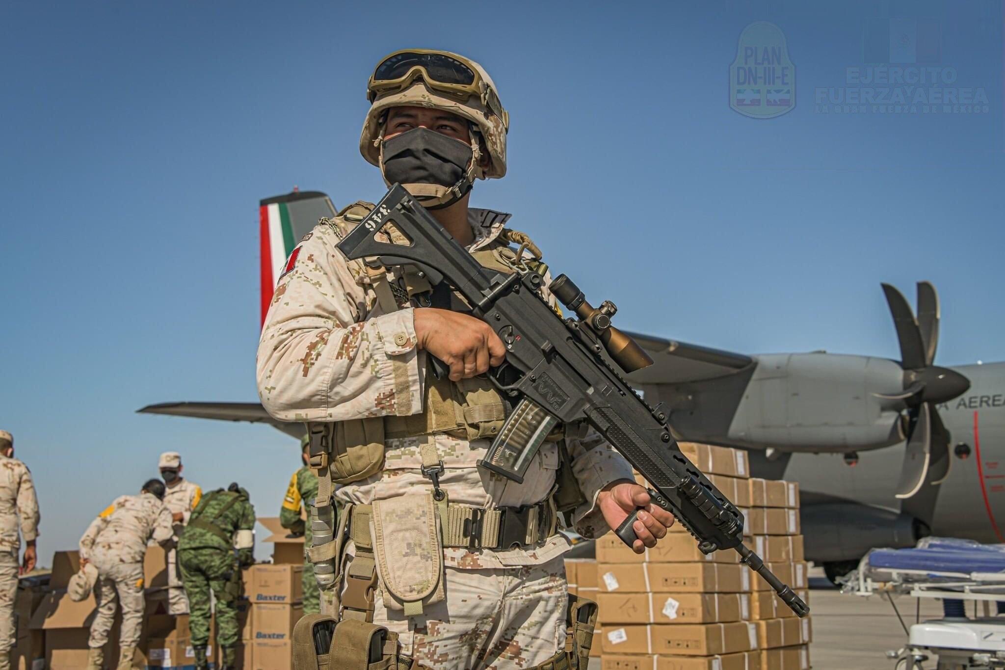 Mexican Army soldier with an FX05 service rifle standing guard wile