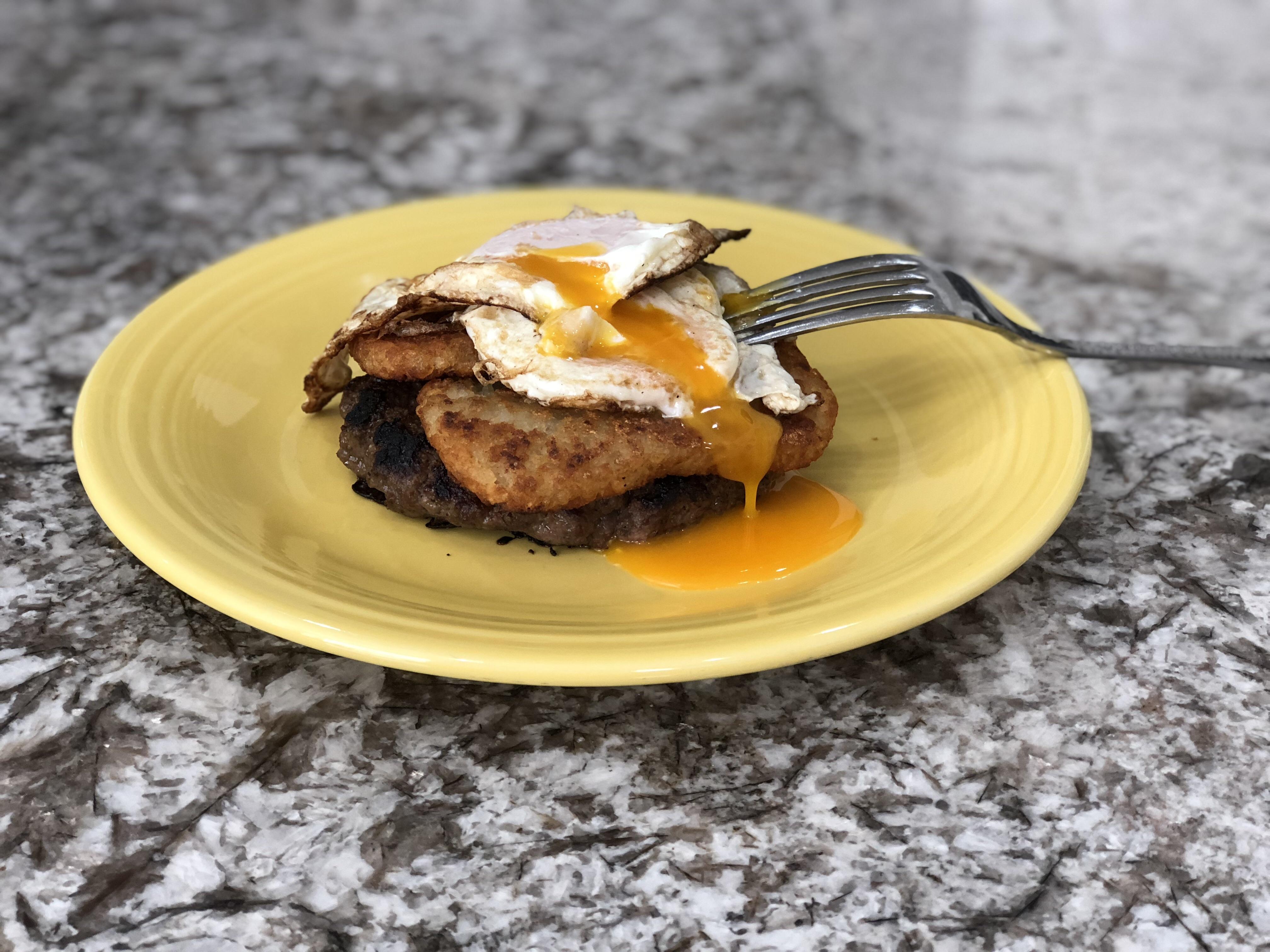 Leftover hamburger patty and Trader Joe’s hashbrowns. Eggs look a