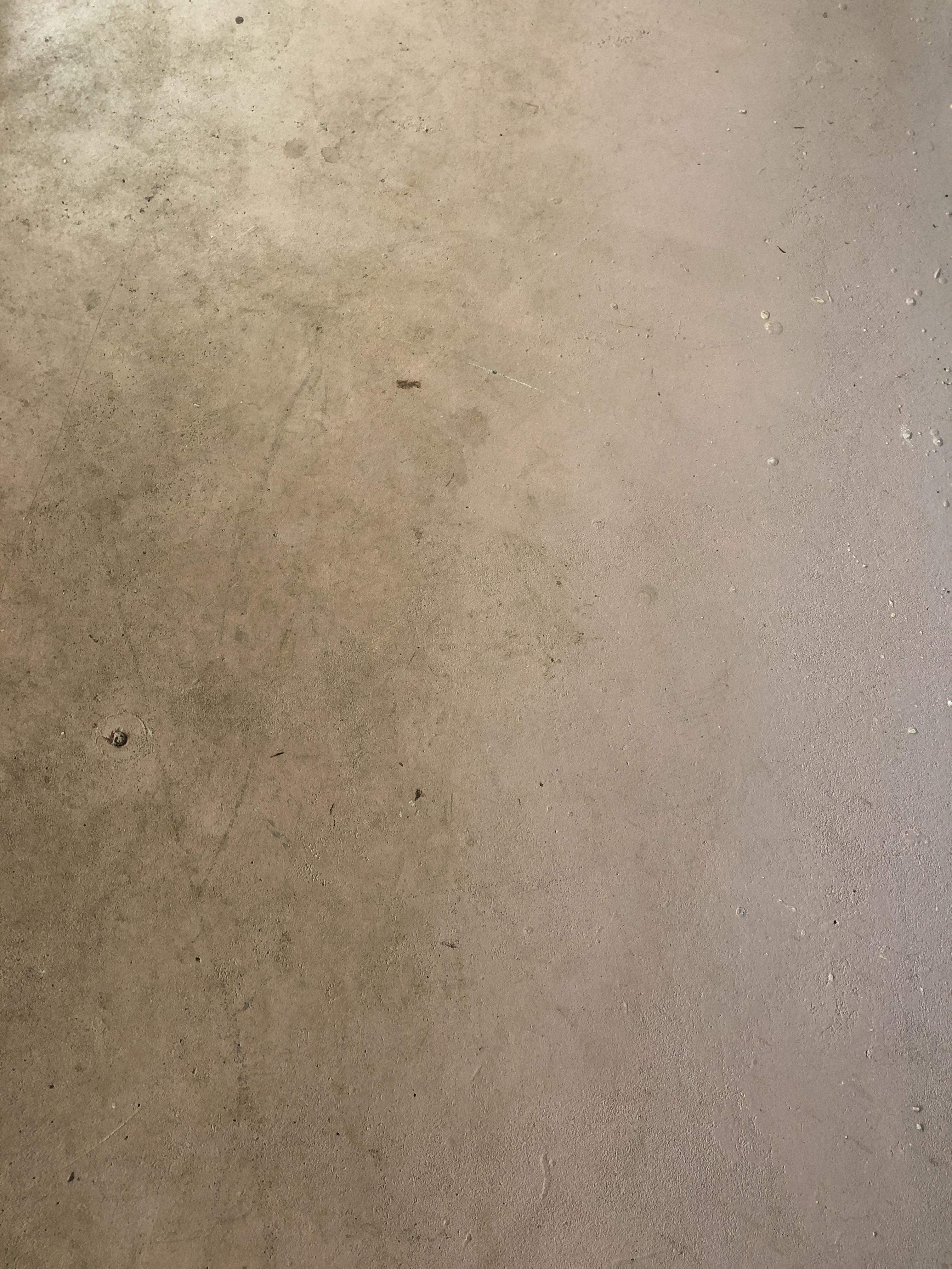 How best to remove hard dirt stains on a painted concrete floor? More