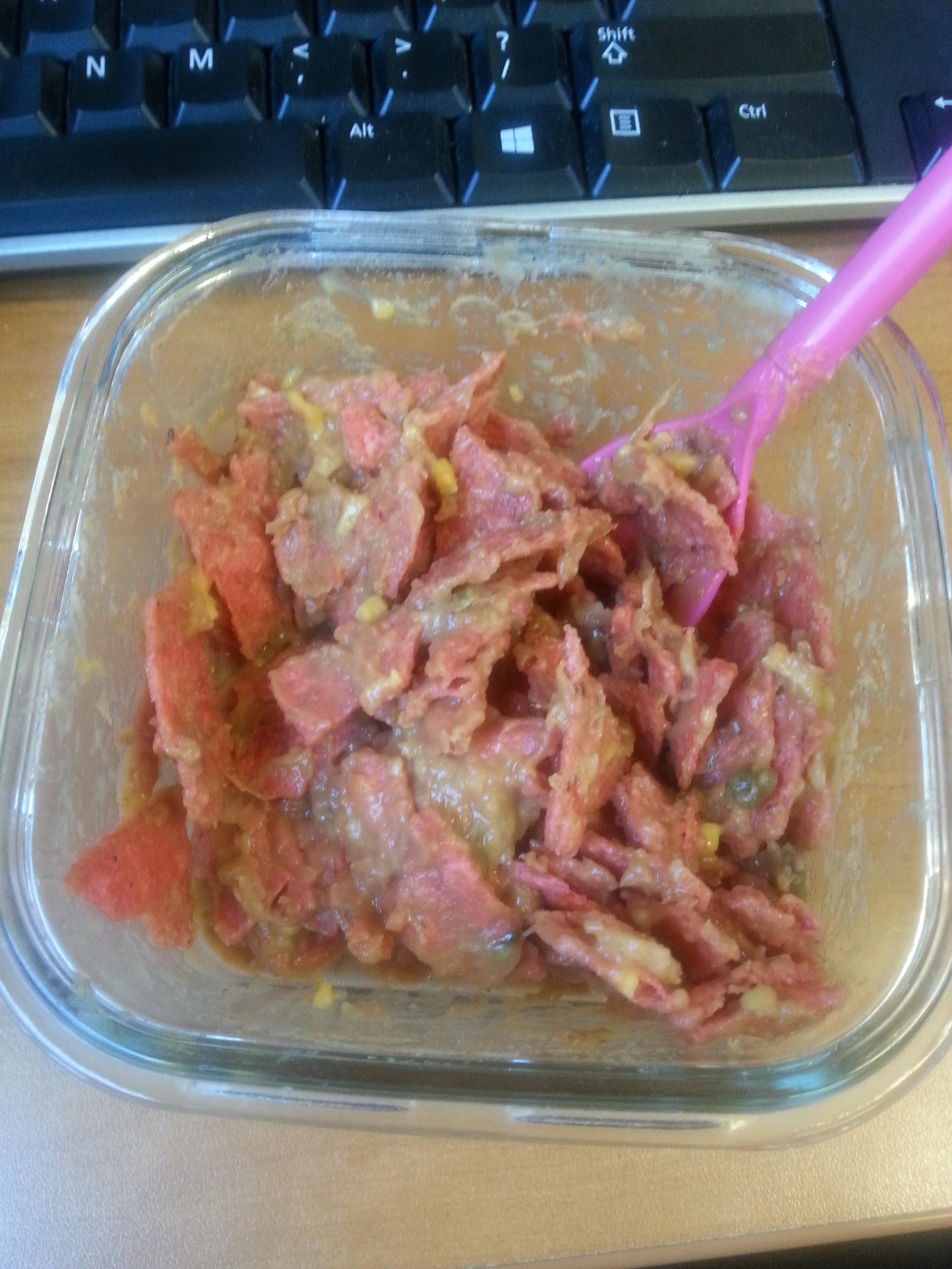 Microwaved refried beans mixed with salsa and daiya w/ tortilla chips