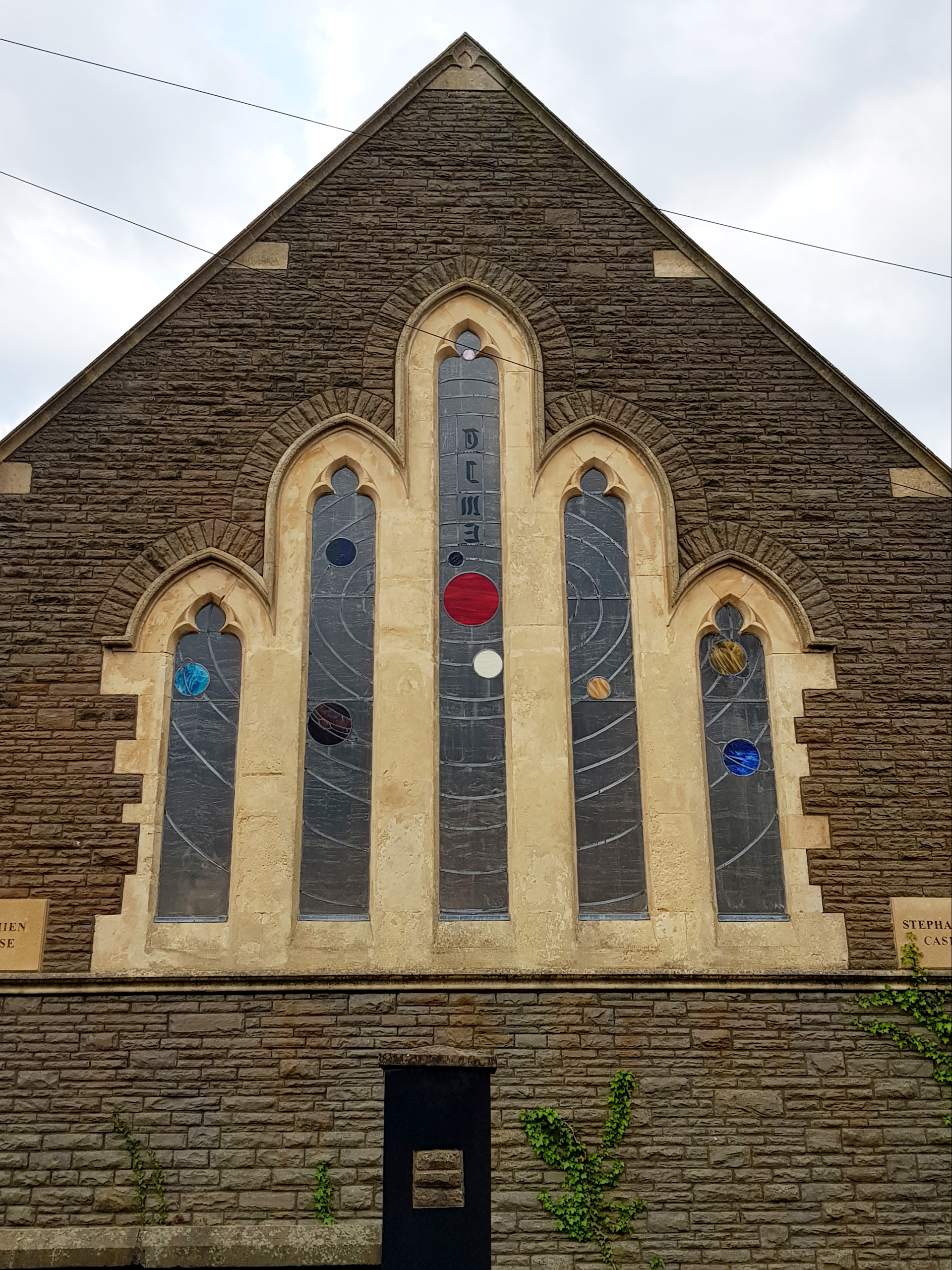 This old church in my hometown has in the stained glass window