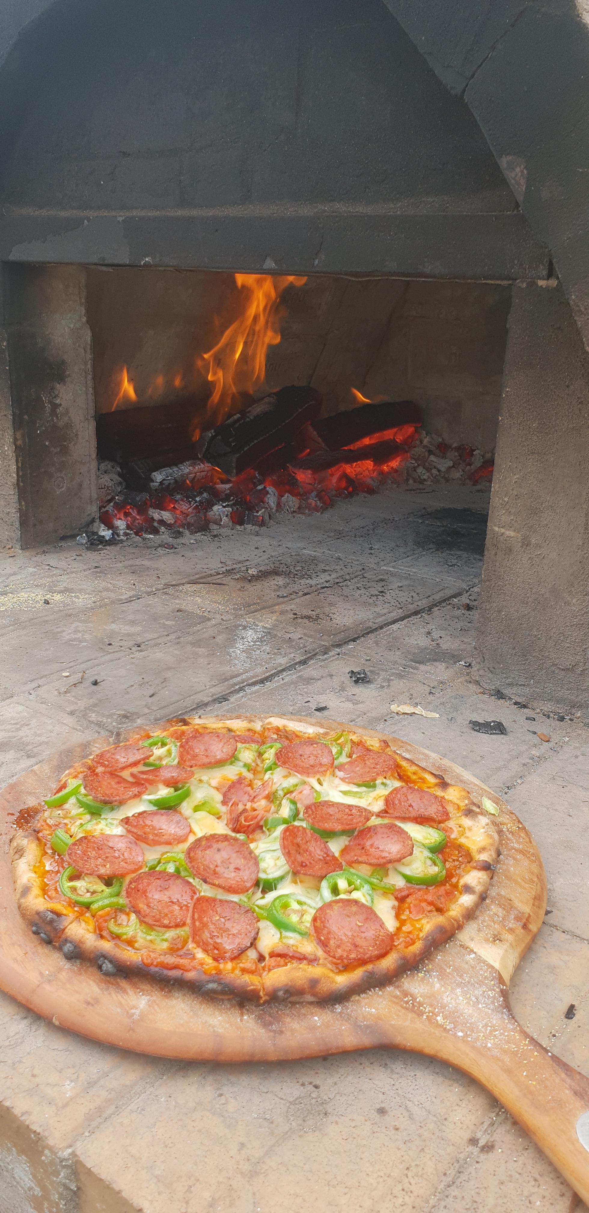 Homemade pepperoni, jalapenos, bell peppers and hot salami r/Pizza