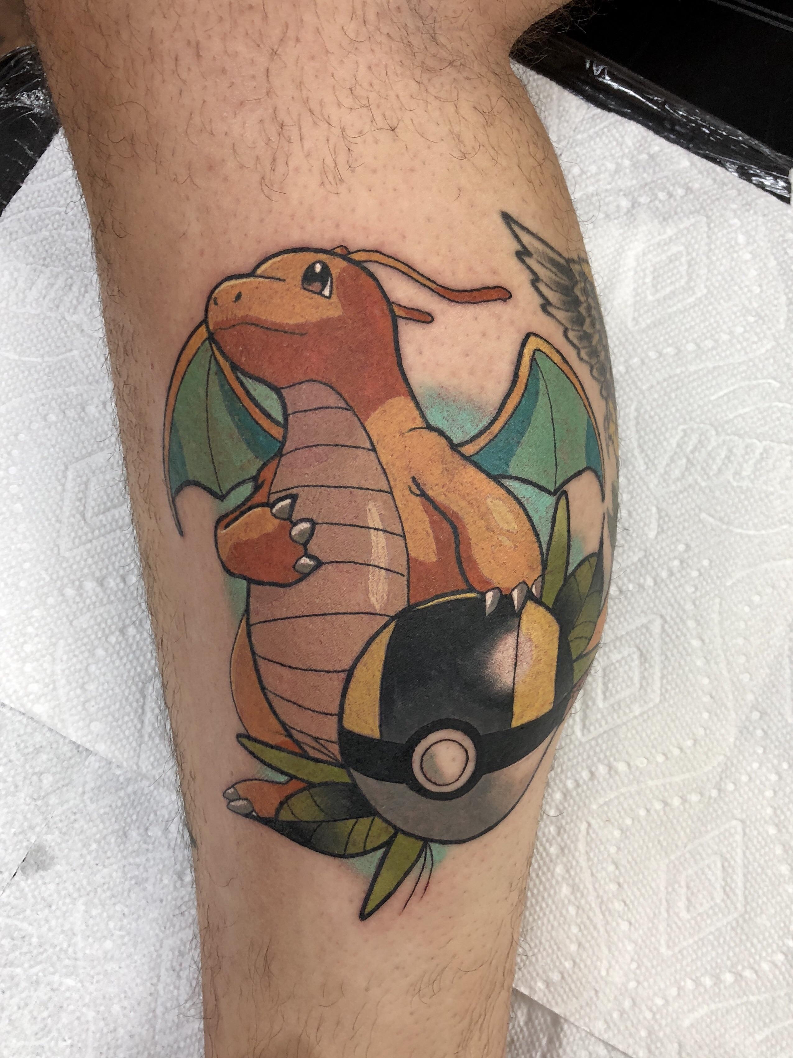 Did this dragonite tattoo yesterday! Wraps a bit around the calf muscle